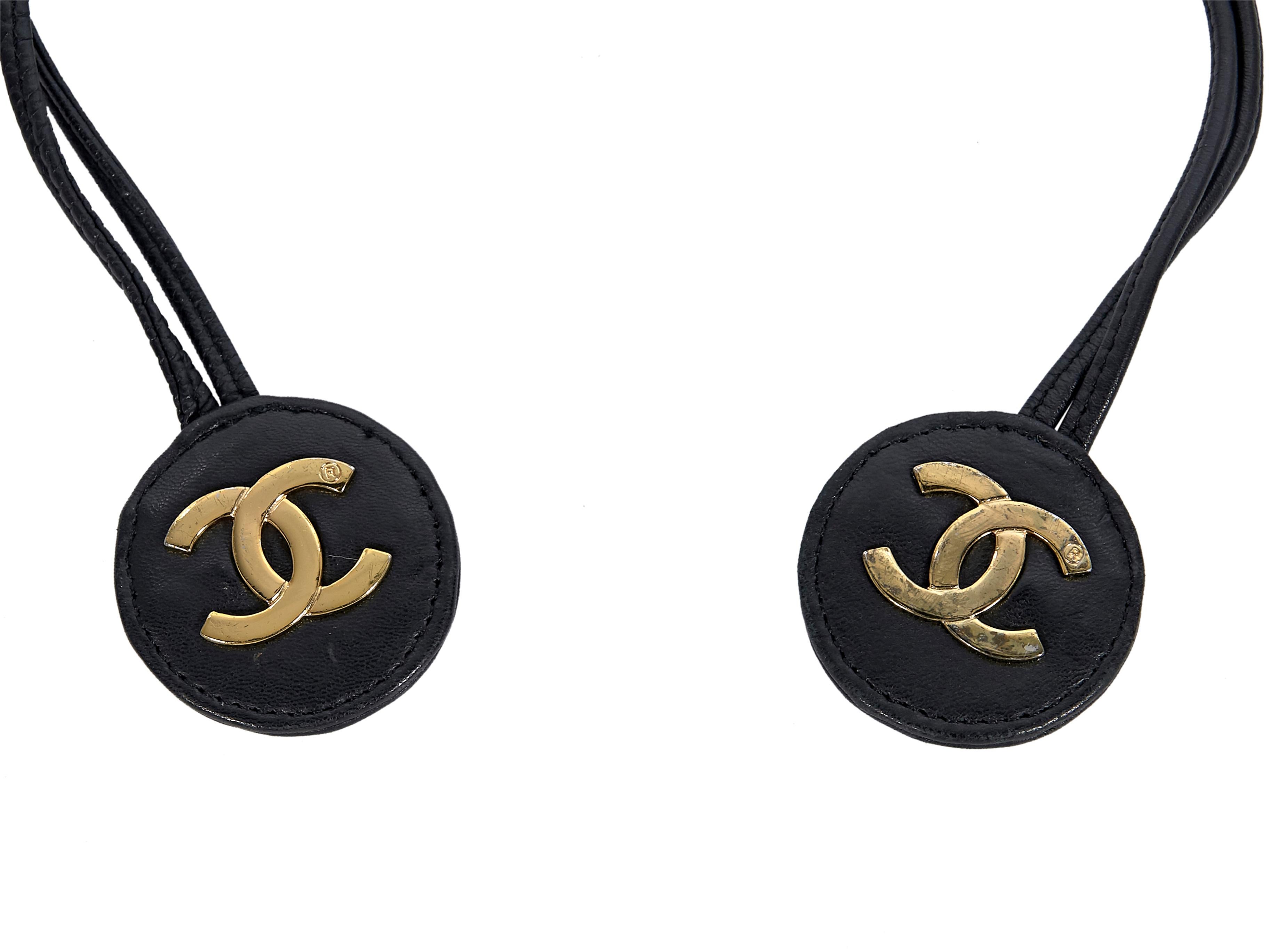 Product details:  Black woven leather and chain belt by Chanel.  Self-tie closure.  Goldtone hardware.  34.5
