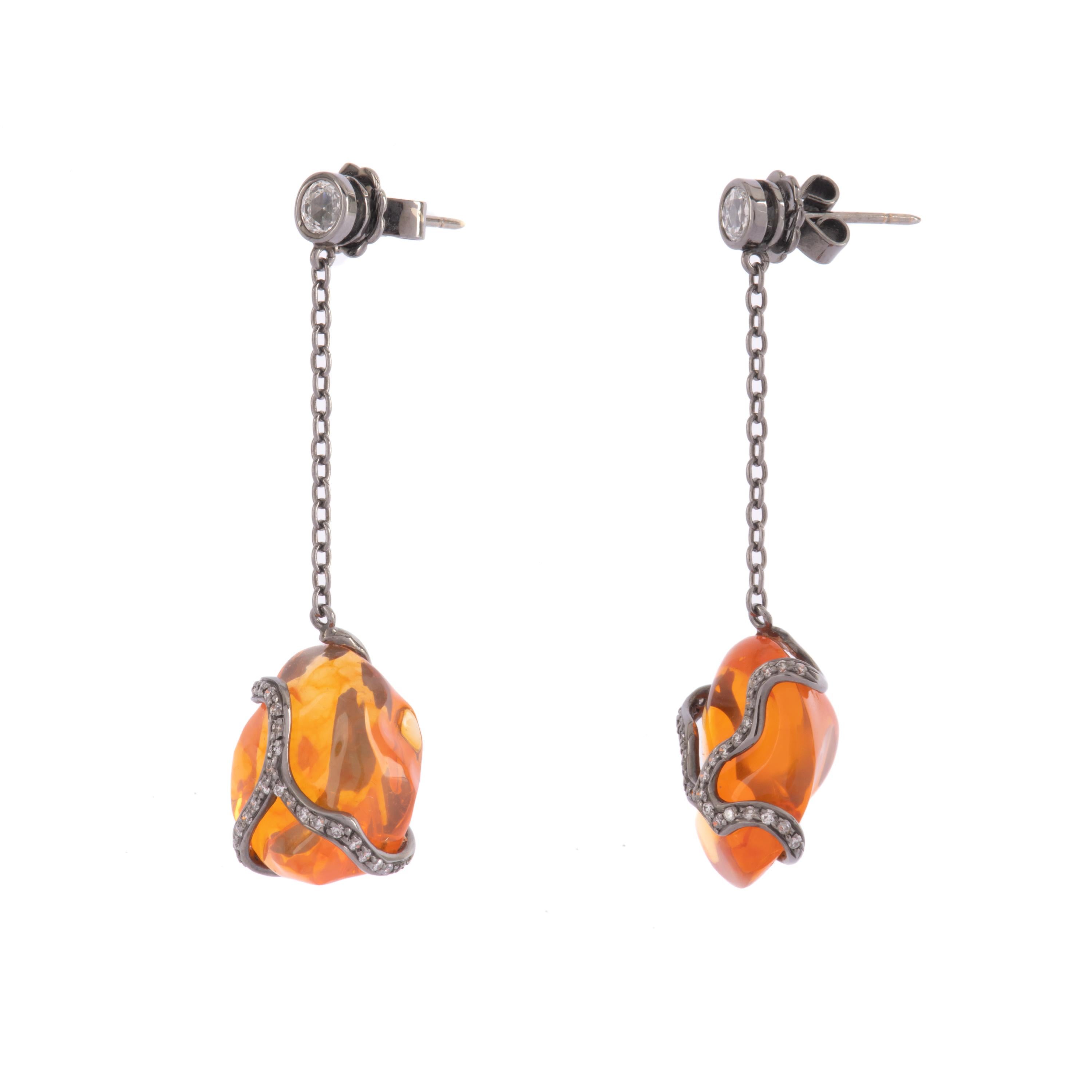 Black gold earrings featured two big fire opal and diamonds designed from Illario.
Tthey are perfect for a sporty night as well as elegant.
Fire opal 19.17 ct
Diamonds 0.76 ct