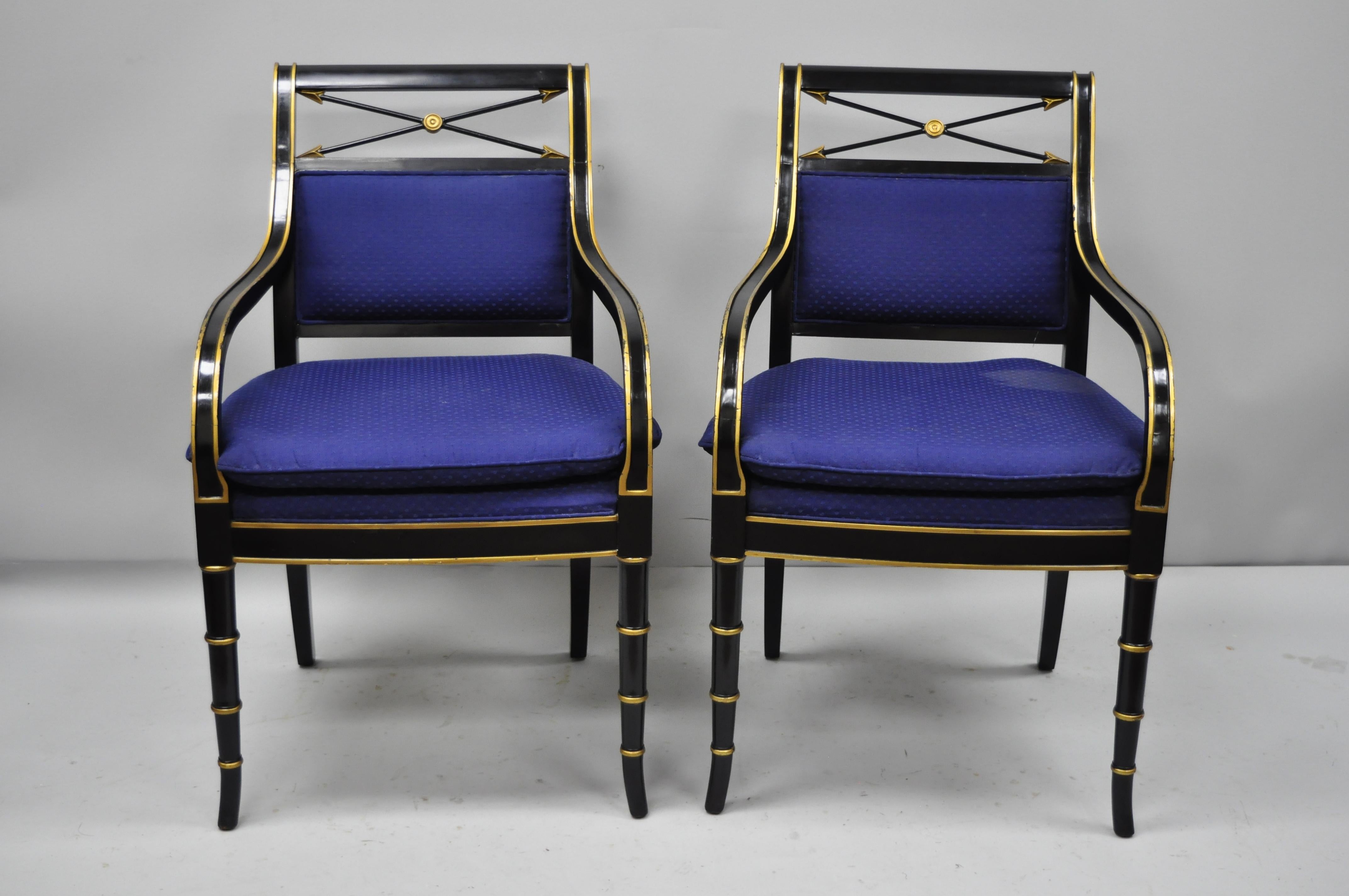 Pair of black and gold English Regency style arrow back armchairs neoclassical chair. Items feature black lacquer and gold gilt finish, cross arrow backs, faux bamboo form legs, upholstered. Solid wood frame, serial number (see image number 9),