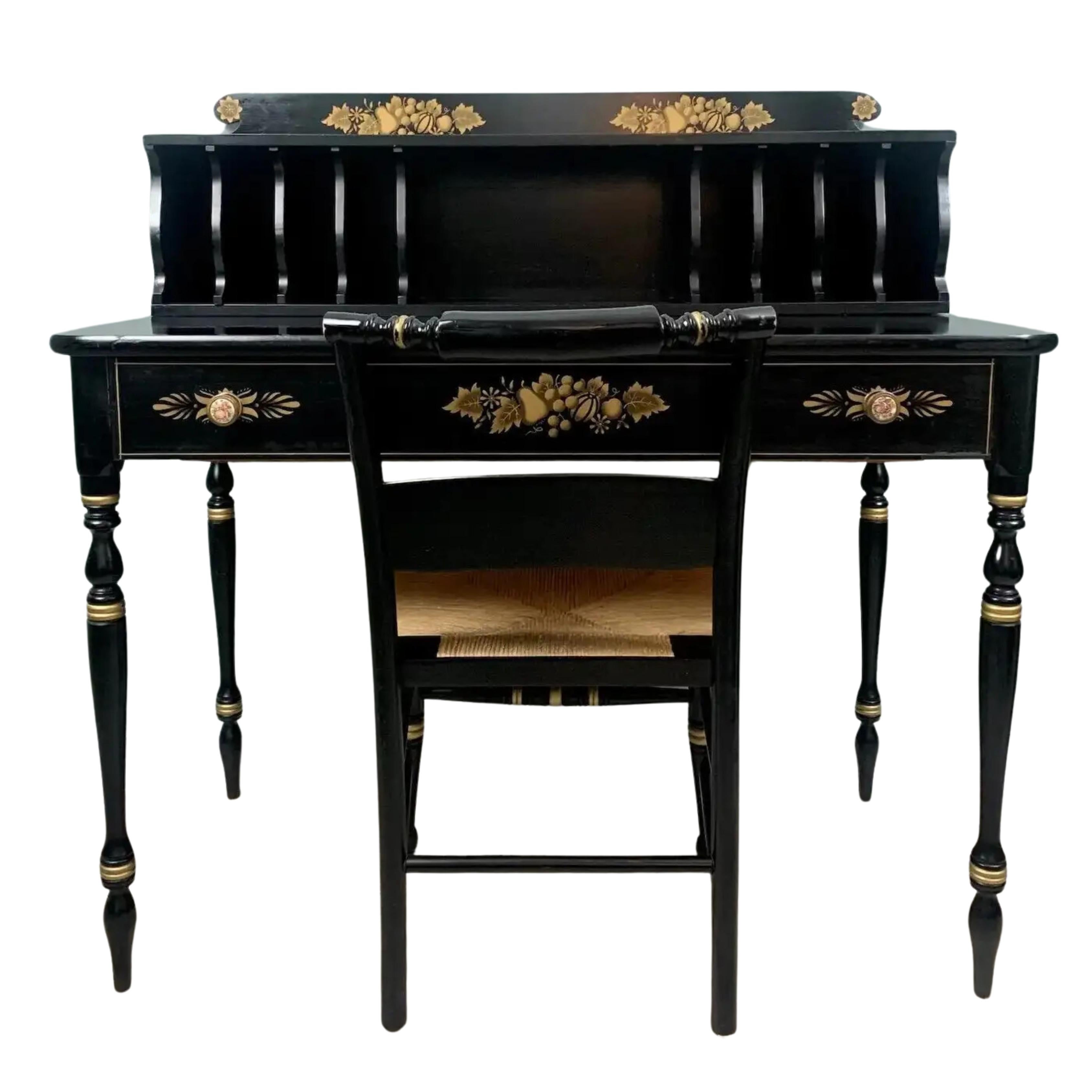 A stunning vintage two-piece set painted in rich black with gold accents featuring the classic Harvest stenciling.  Beautiful brass/porcelain drawer pulls depicting a painted scene on each, replicating the timeless Hitchcock style popularized in the