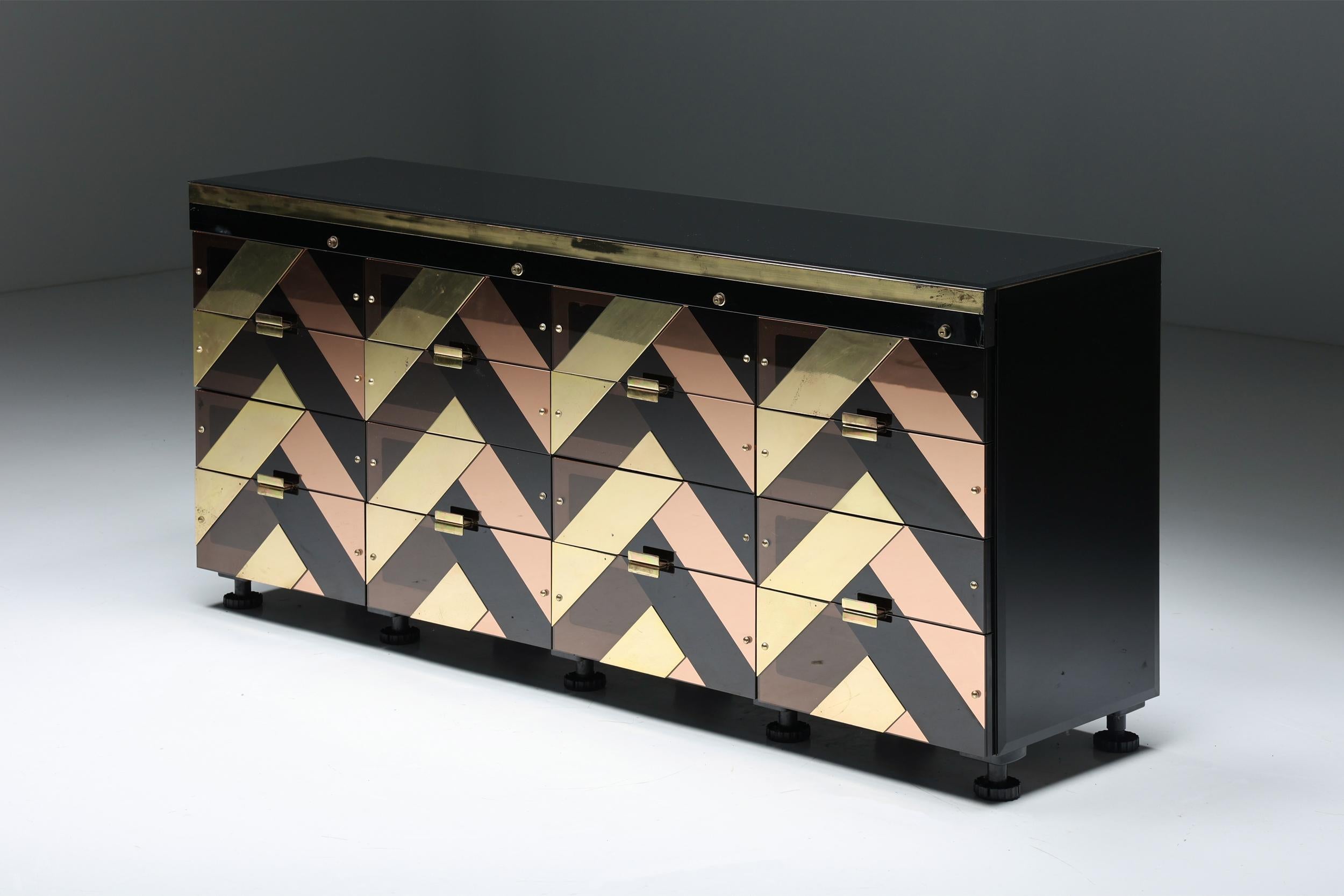 Brass; Smoked Perspex; Black Glass; Drawers; Credenza; Italian Design; Italy; Hollywood Regency; Black & Gold; Sideboard; 

This credenza, a 16-drawer high-end storage piece, is custom-made. Black hyalith glass sides and top. The drawers' fronts
