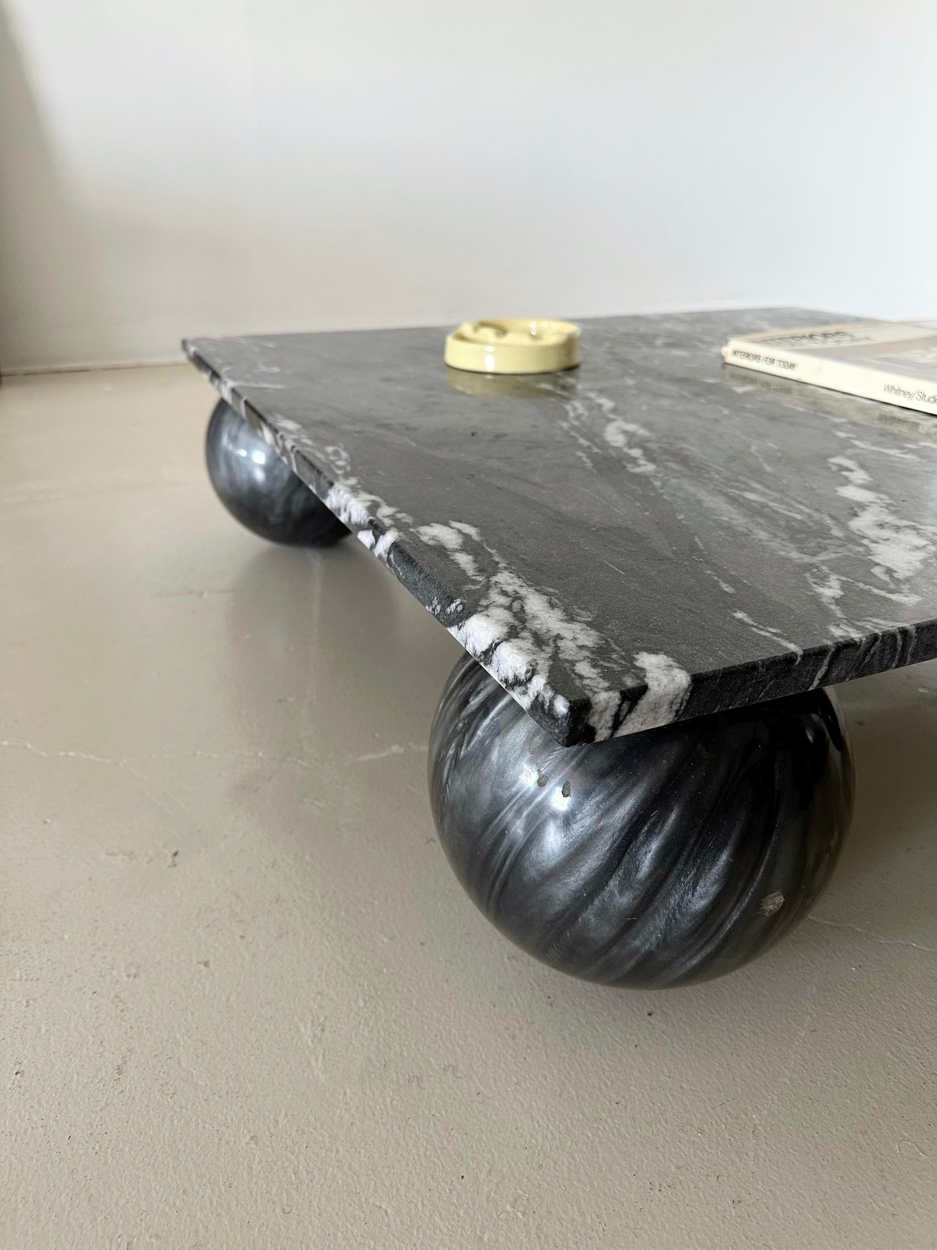Black Granite Low Coffee Table with Resin Sphere Base

*Very Good condition, no cracks or imperfections on granite top. Please note that this is a very heavy table.