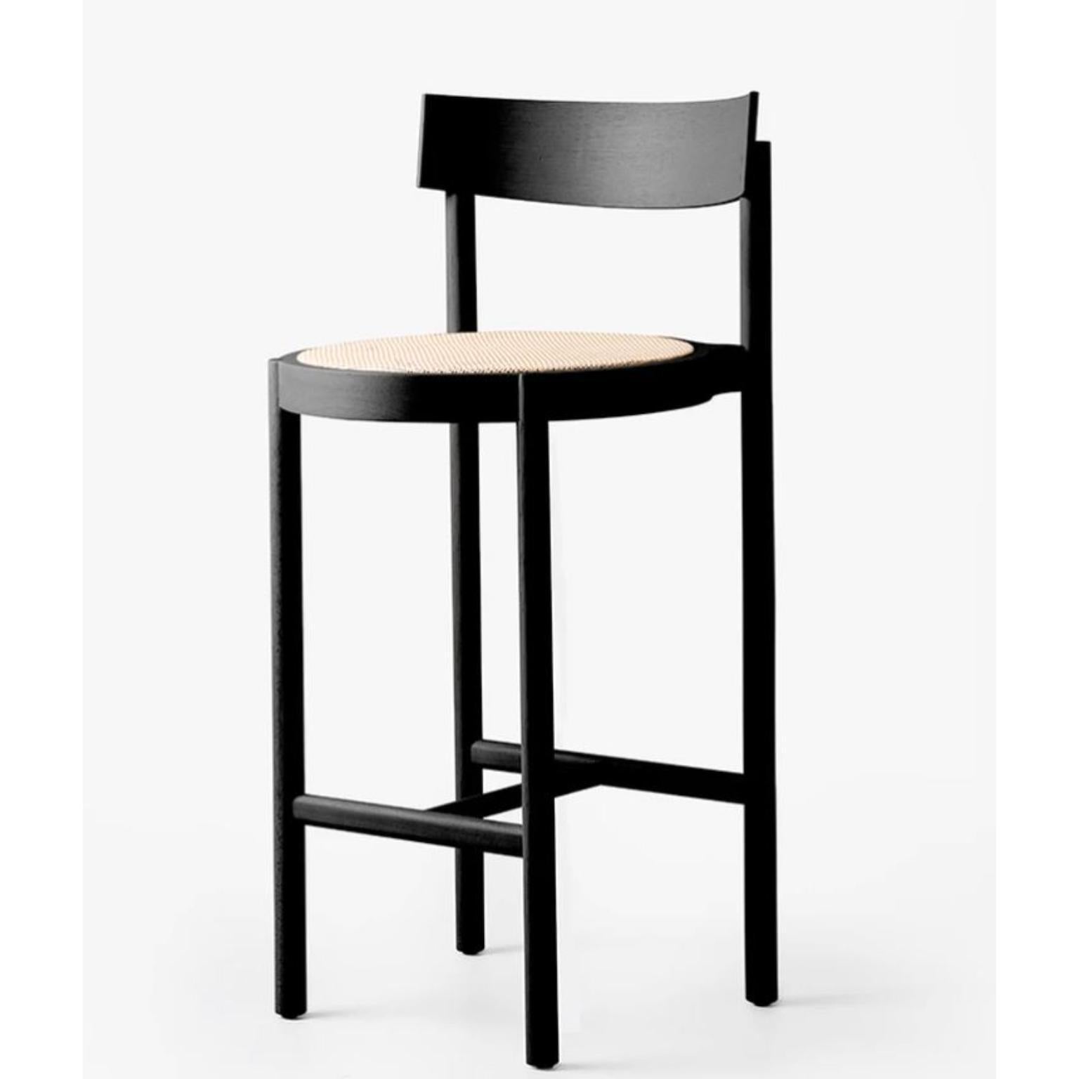 Black Gravatá Bar Stool by Wentz
Dimensions: D 52 x W 47 x H 100 cm
Materials: Tauari Wood, Cane/Upholstery.
Weight: 4,7kg / 10,4 lbs

The Gravatá series synthesizes our vision regarding the functional and visual simplicity of furniture. Through