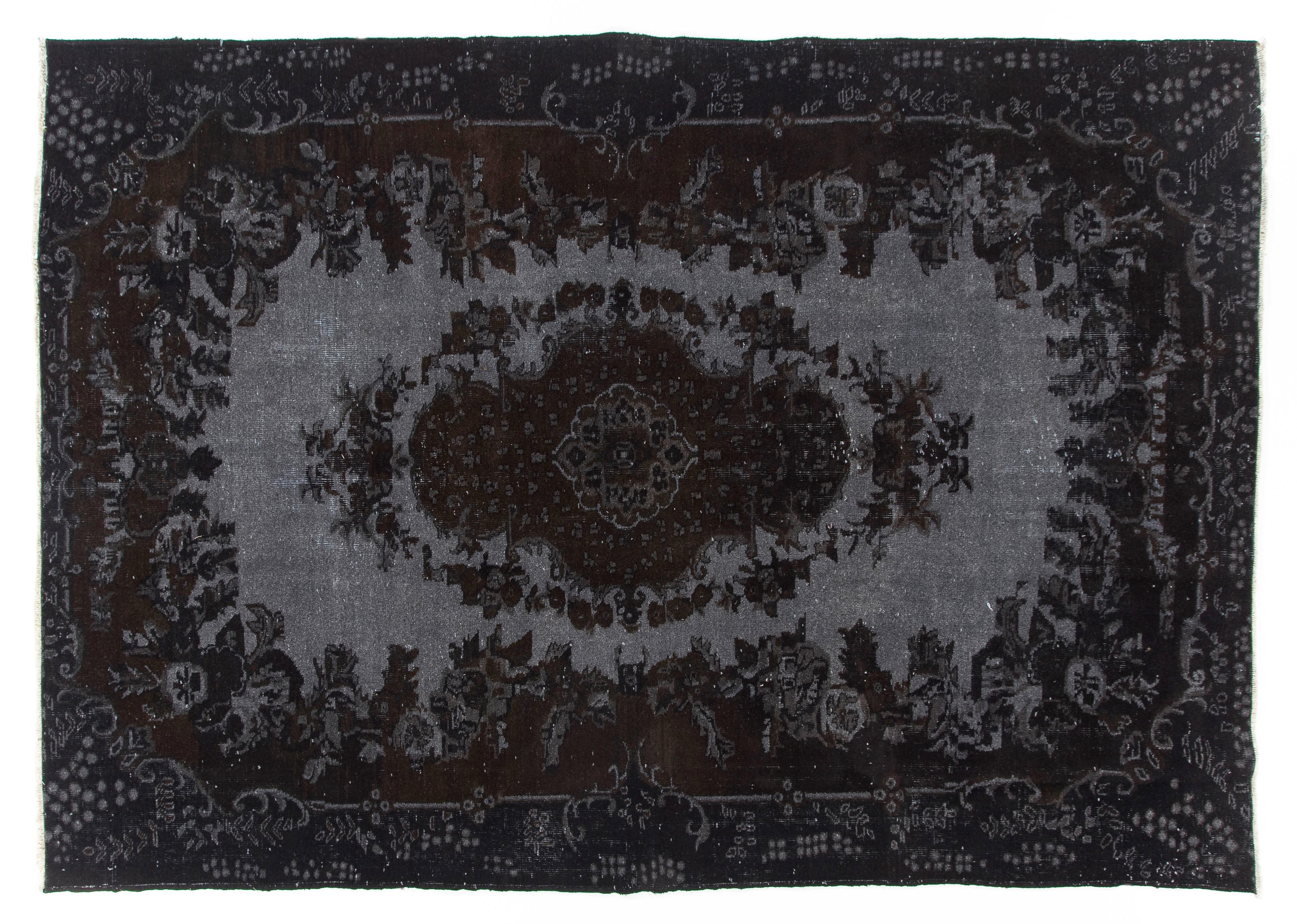 A vintage Turkish area rug re-dyed in black color for contemporary interiors.
Finely hand knotted, low wool pile on cotton foundation. Professionally washed.
Sturdy and can be used on a high traffic area, suitable for both residential and commercial