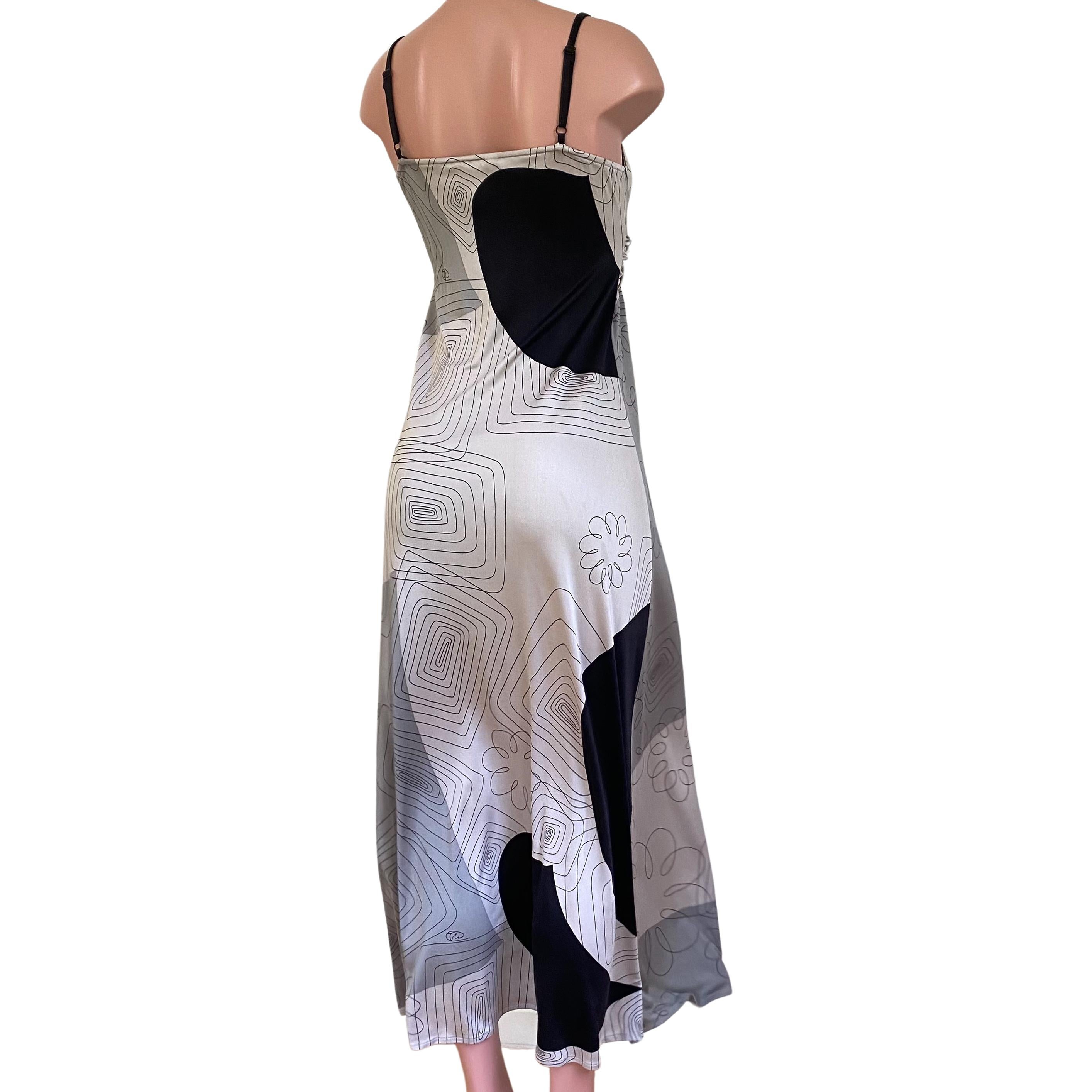 Cool, easy breezy twist front maxi cami dress with adjustable shoulder straps for a perfect, flattering fit.
Original freehand scribble print signed by Flora.
Approximately 57