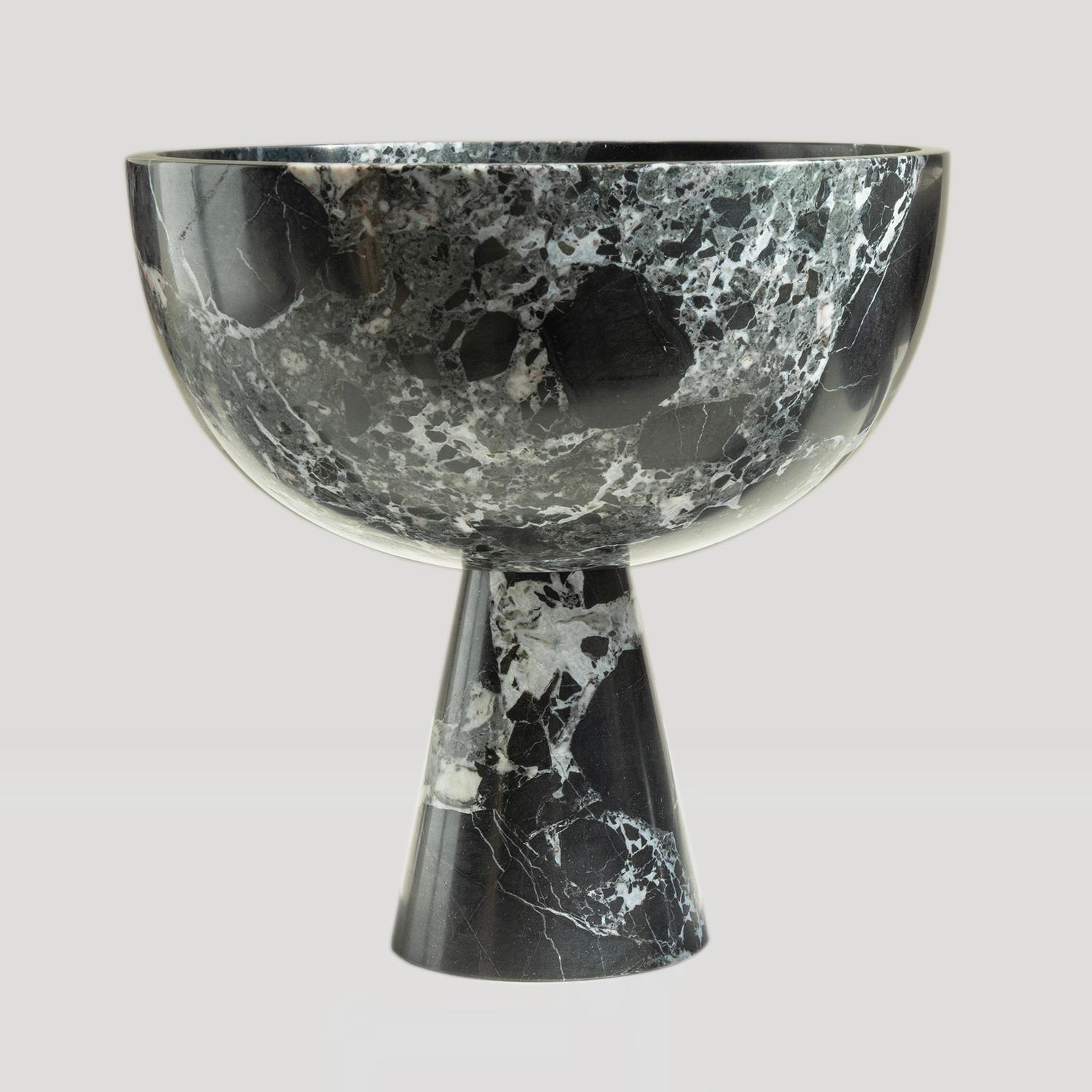 Introducing our stunning Black Marble Pedestal Bowl, a captivating fusion of style and utility. Crafted from premium black marble with deep green color nuances, this bowl boasts a unique and eye-catching aesthetic that instantly enhances any space.
