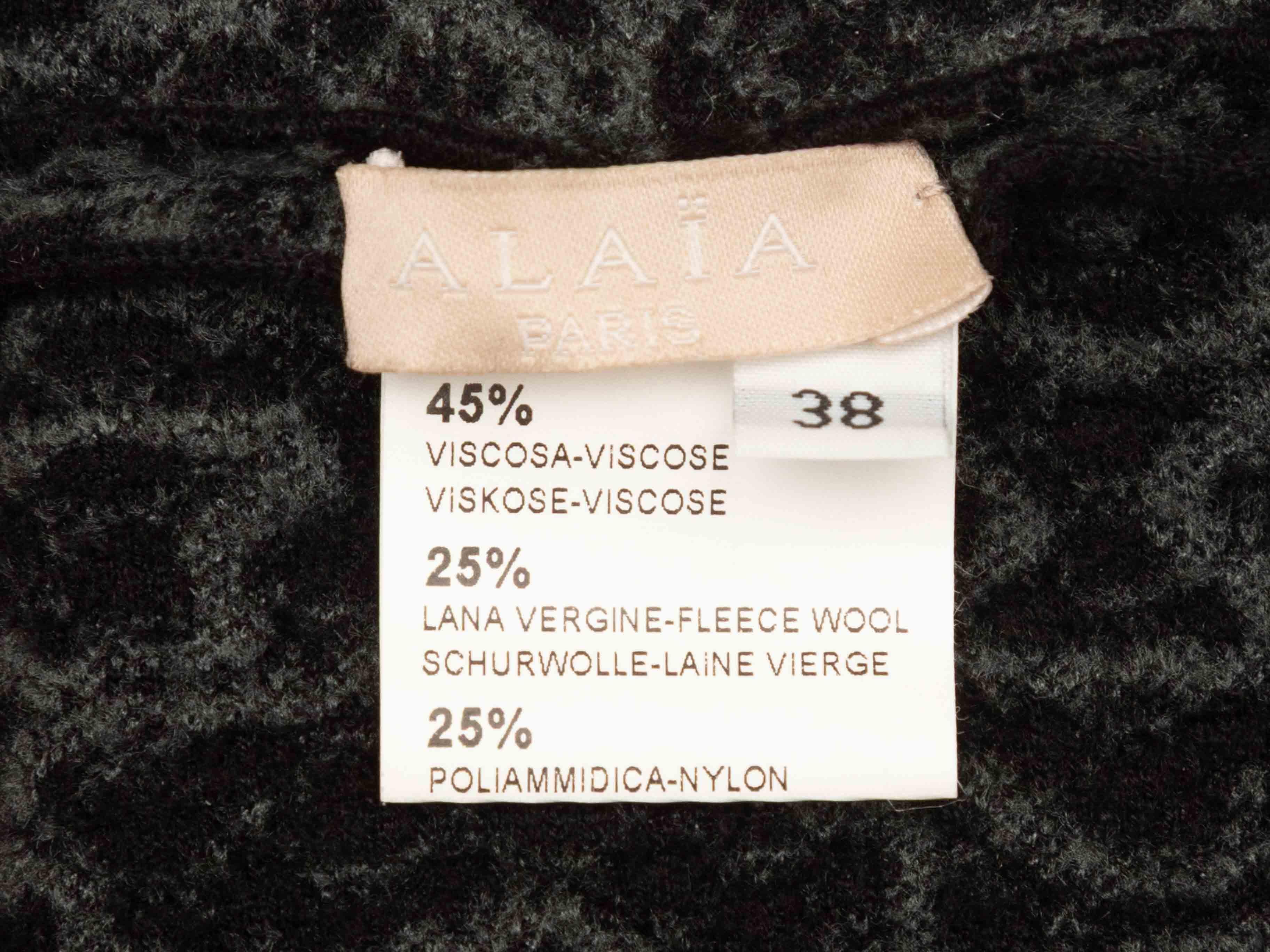 Schwarzes und graues ärmelloses Kleid aus einer Wollmischung von Alaia. V-Ausschnitt. Reißverschluss am Rücken. 27
