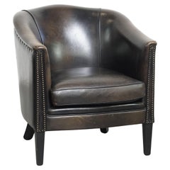 Fauteuil club noir/gris en cuir de mouton
