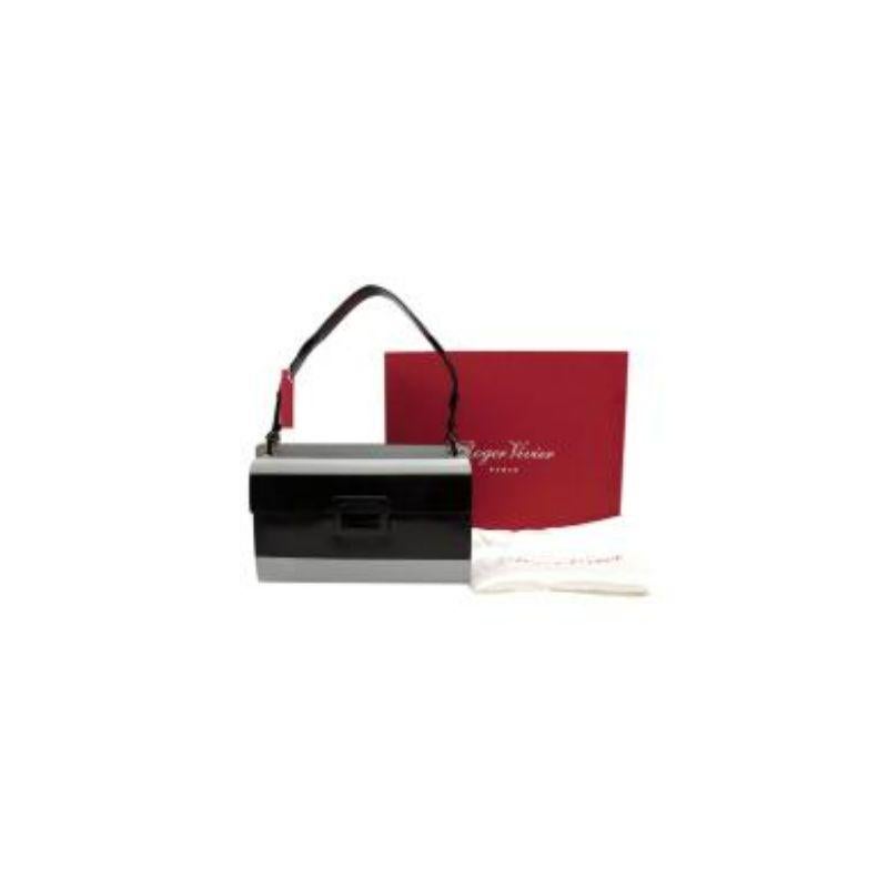 Roger Vivier black & grey patent leather Colourblock Miss Viv bag
 
 - Bold, colour block exterior in a lightweight grey and black patent
 -Adjustable strap 
 -Divided into two compartments
 -Each side opens with a flap and magnetic-snap
 -One flap