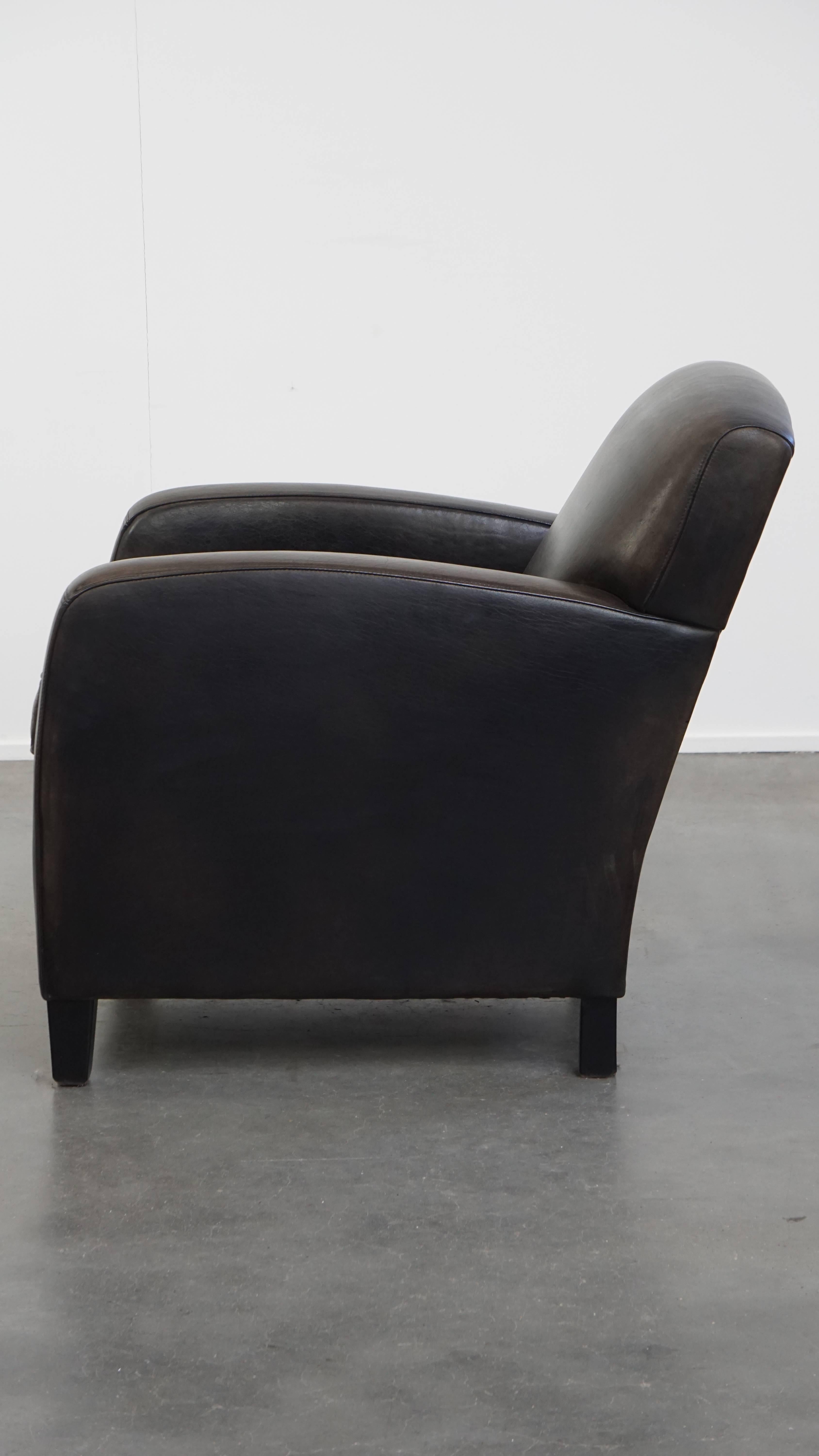 Sillón de diseño en piel de oveja negra/gris en Bueno estado para la venta en Harderwijk, NL