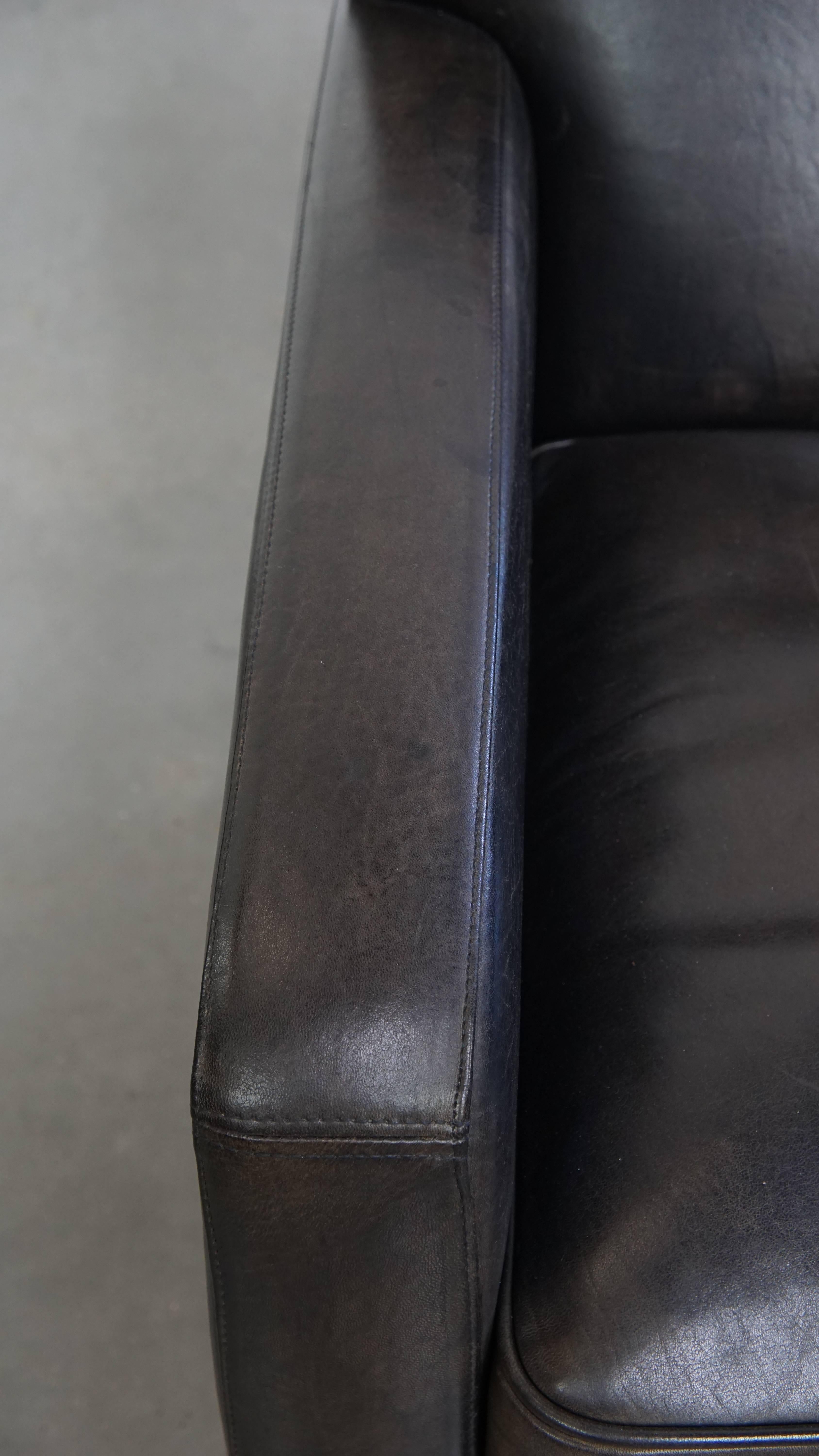 Sillón de diseño en piel de oveja negra/gris Cuero en venta