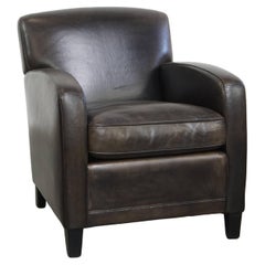 Sillón de diseño en piel de oveja negra/gris