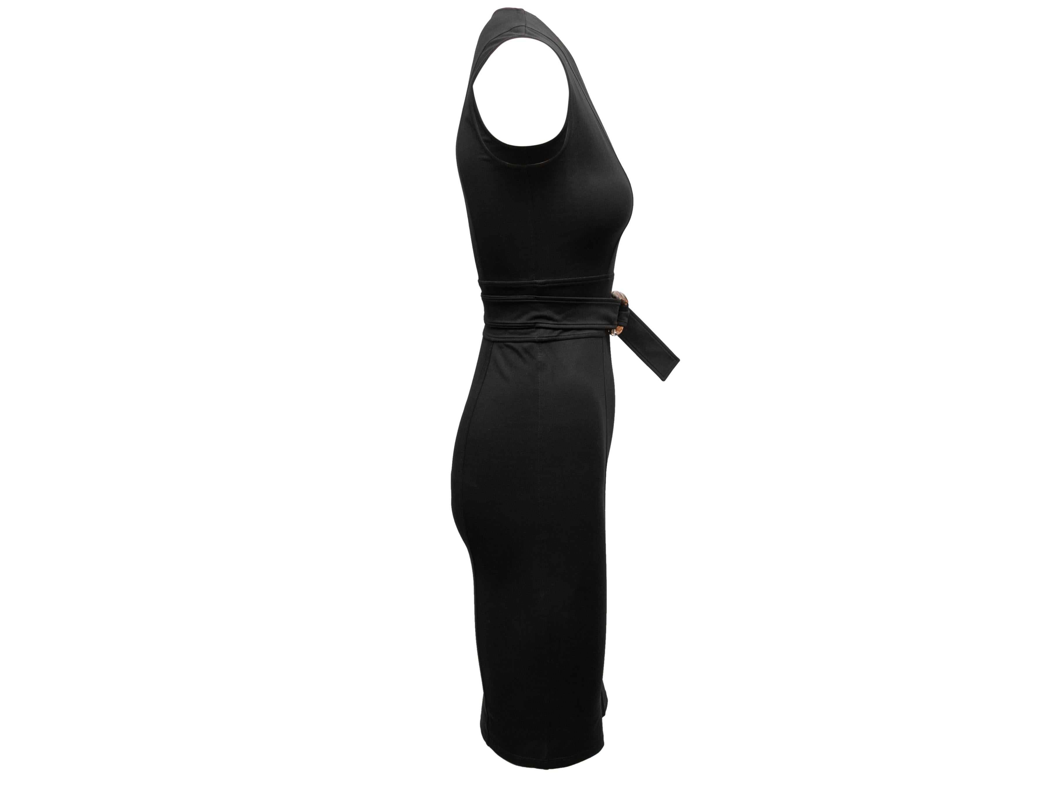 Black sleeveless bodycon dress by Gucci. V-neck. Bamboo belt accent at waist. 30