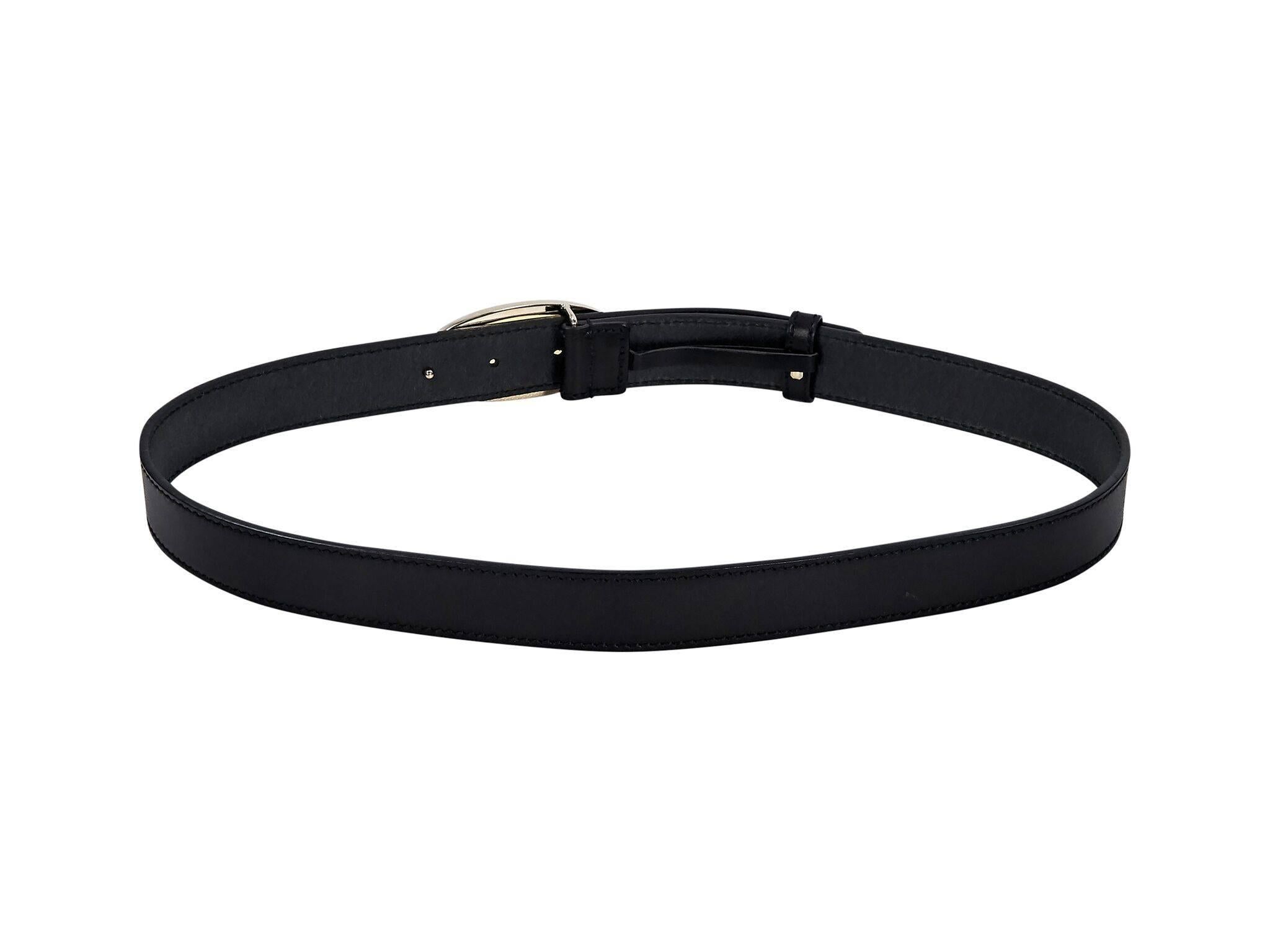 Product details:  Black leather belt by Gucci.  Oval logo buckle.  Adjustable closure.  Goldtone hardware.  37