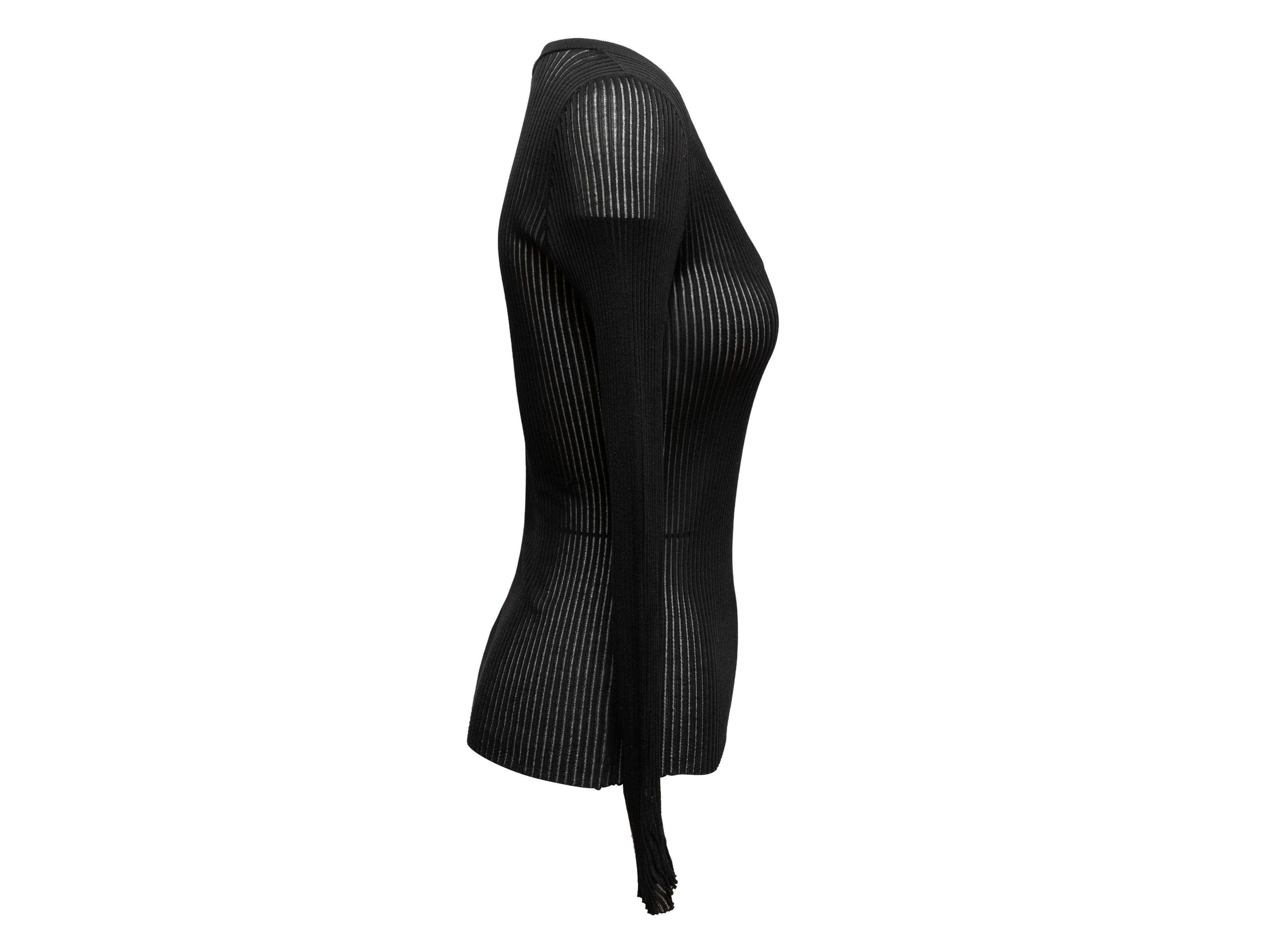 Black ribbed long sleeve top by Gucci. V-neck. 27
