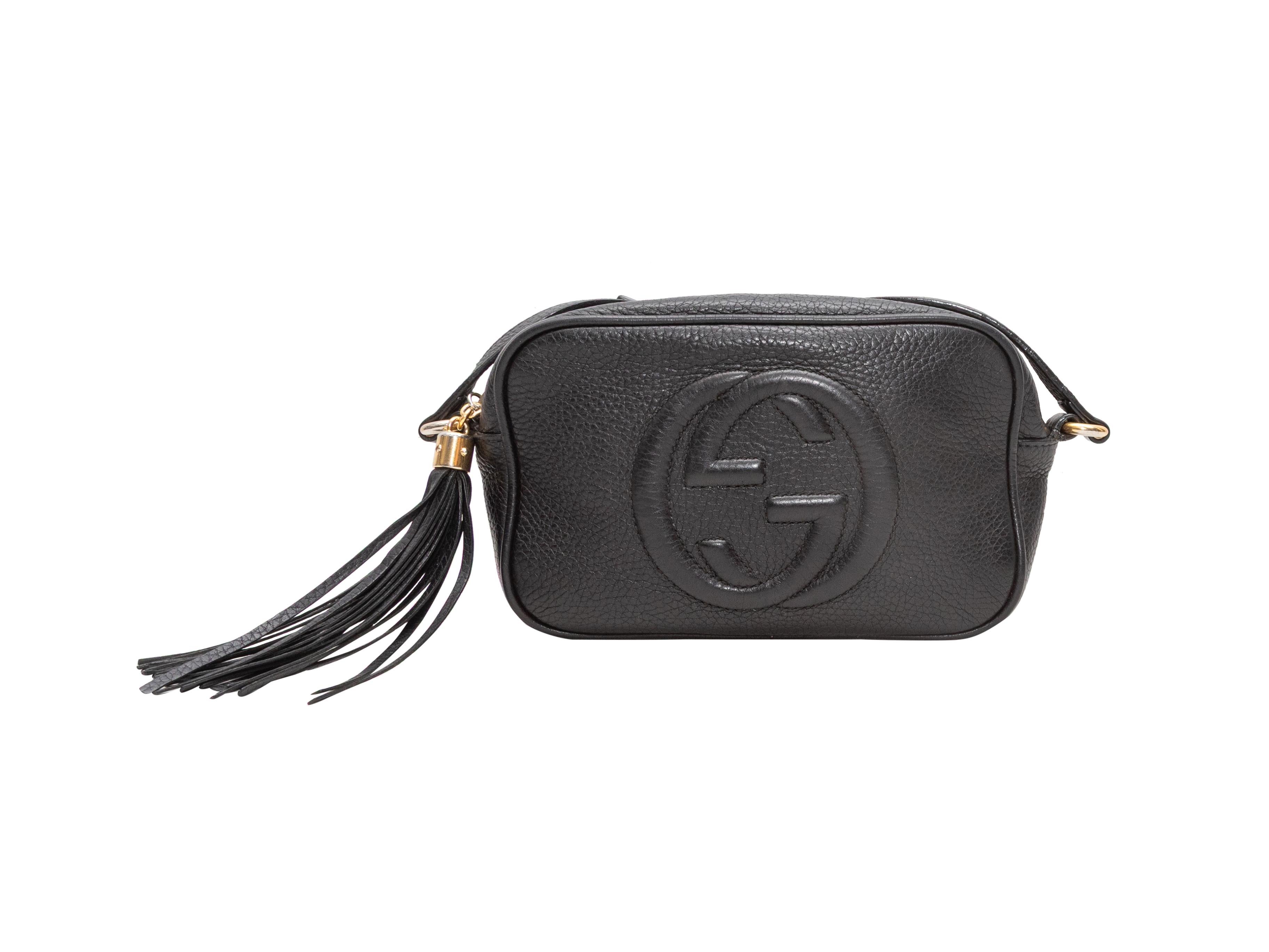 Black Gucci Small Disco Crossbody Bag. The Small Disco Crossbody Bag features a leather body, gold-tone hardware, a tassel accent, a single crossbody strap, and a top zip closure. 7.25