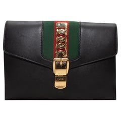 Pochette nera in pelle bordata di Gucci Sylvie