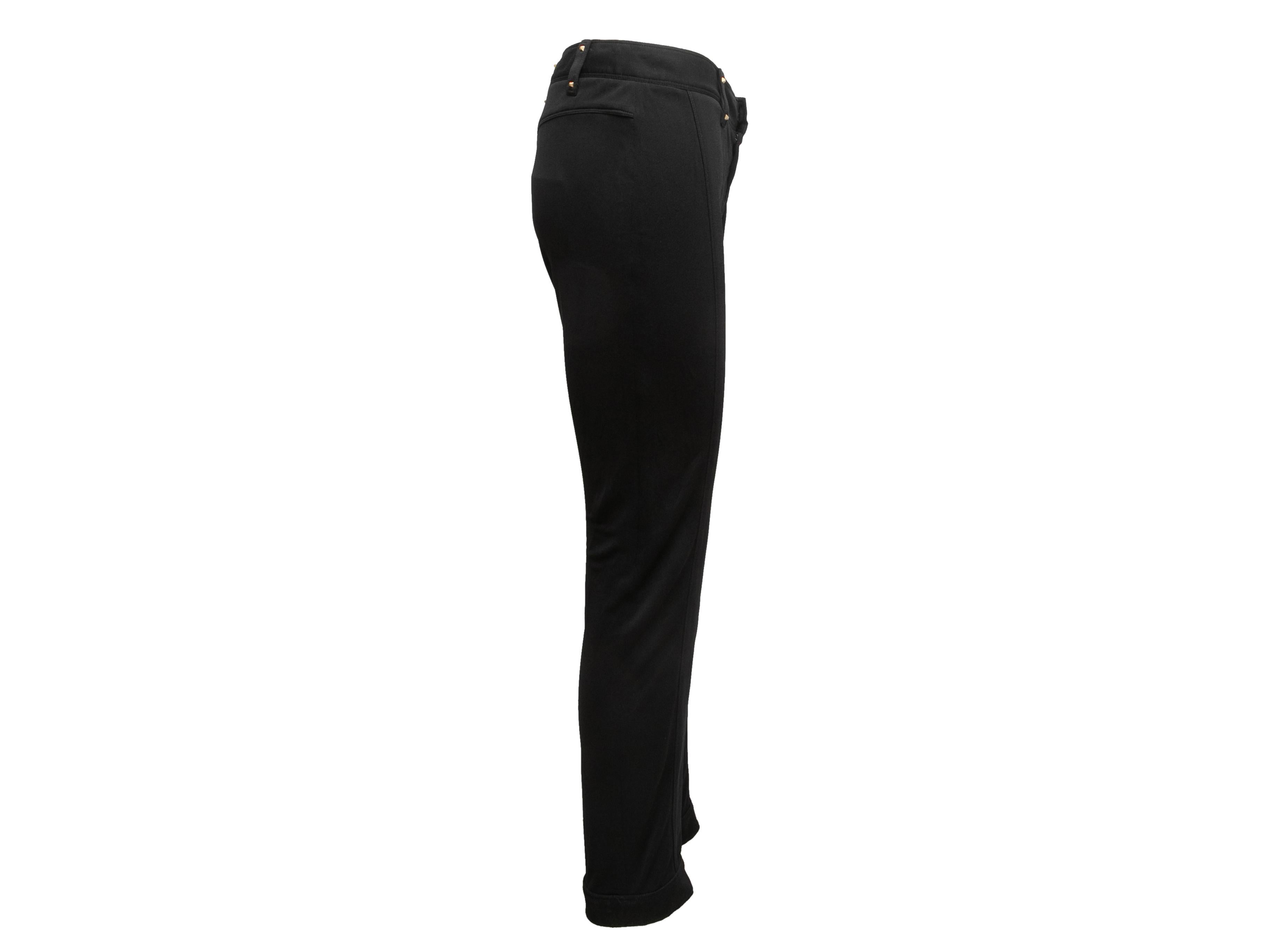 Black skinny-leg pants by Gucci. From the Tom Ford era. Dual back pockets. Zip closure at front. 32