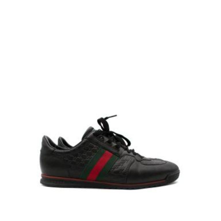 Gucci Black Guccissima leather web stripe trainers
 

 - Low top, retro-inspired trainers
 - Iconic web stripe detail on the outer side
 - Lace up
 - Rubber sole 
 

 Materials:
 Leather 
 Rubber
 

 Made in Italy 
 

 9/10 very good condition, with