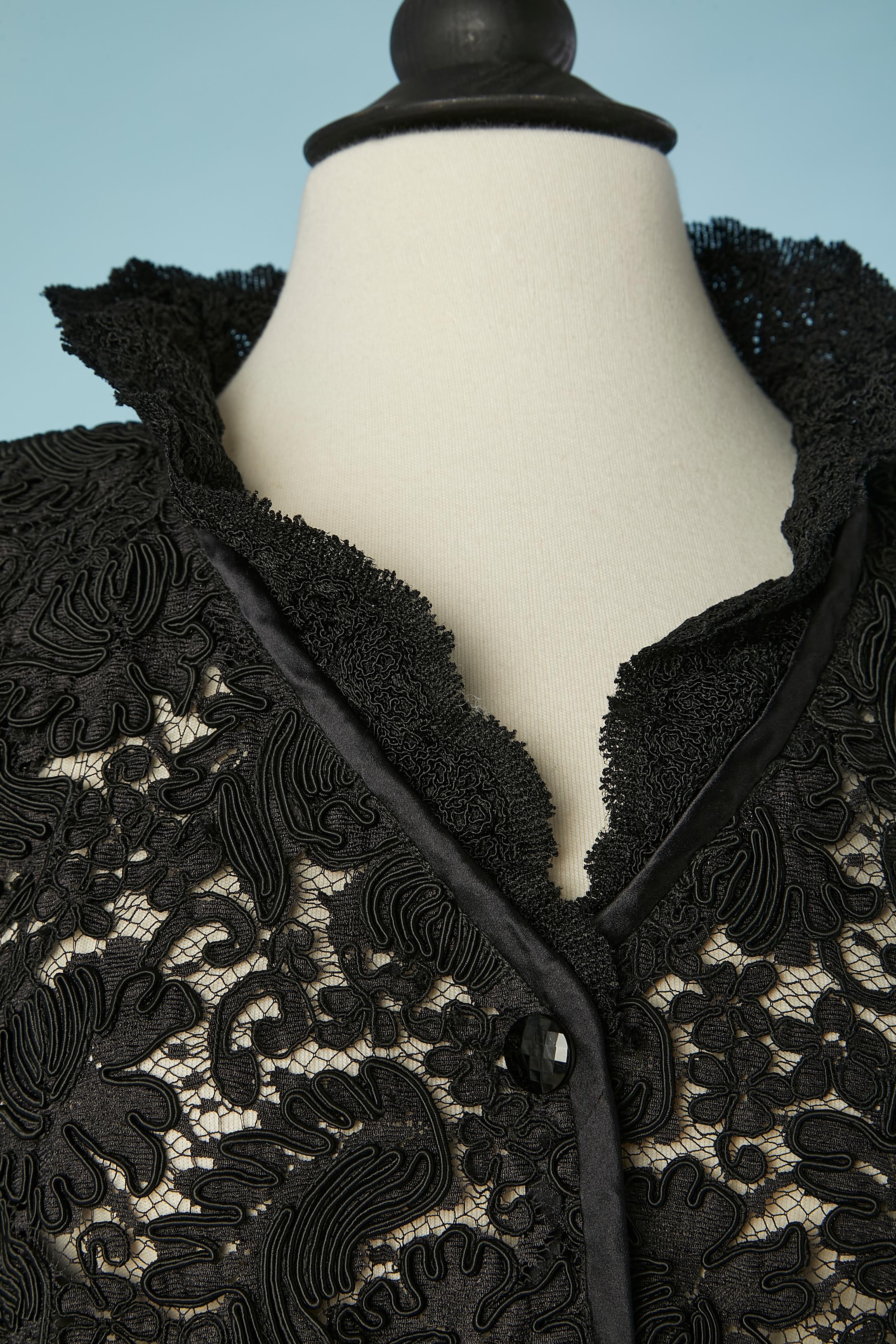  Black guipure evening jacket with ruffle collar. Black satin piping. Shoulder pad. See-through. One snap covered with fabric in the top middle front. 
SIZE 38