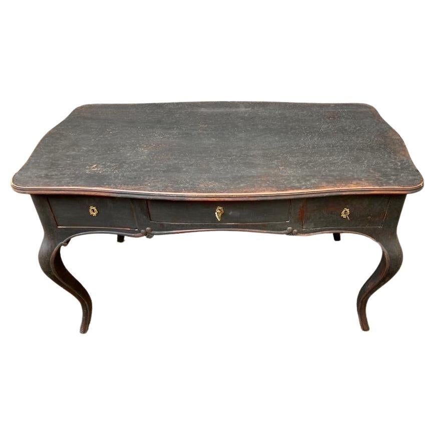 Swedish gustavian office writing desk in gustavian black paint with three drawers and the original brass hardware.
 