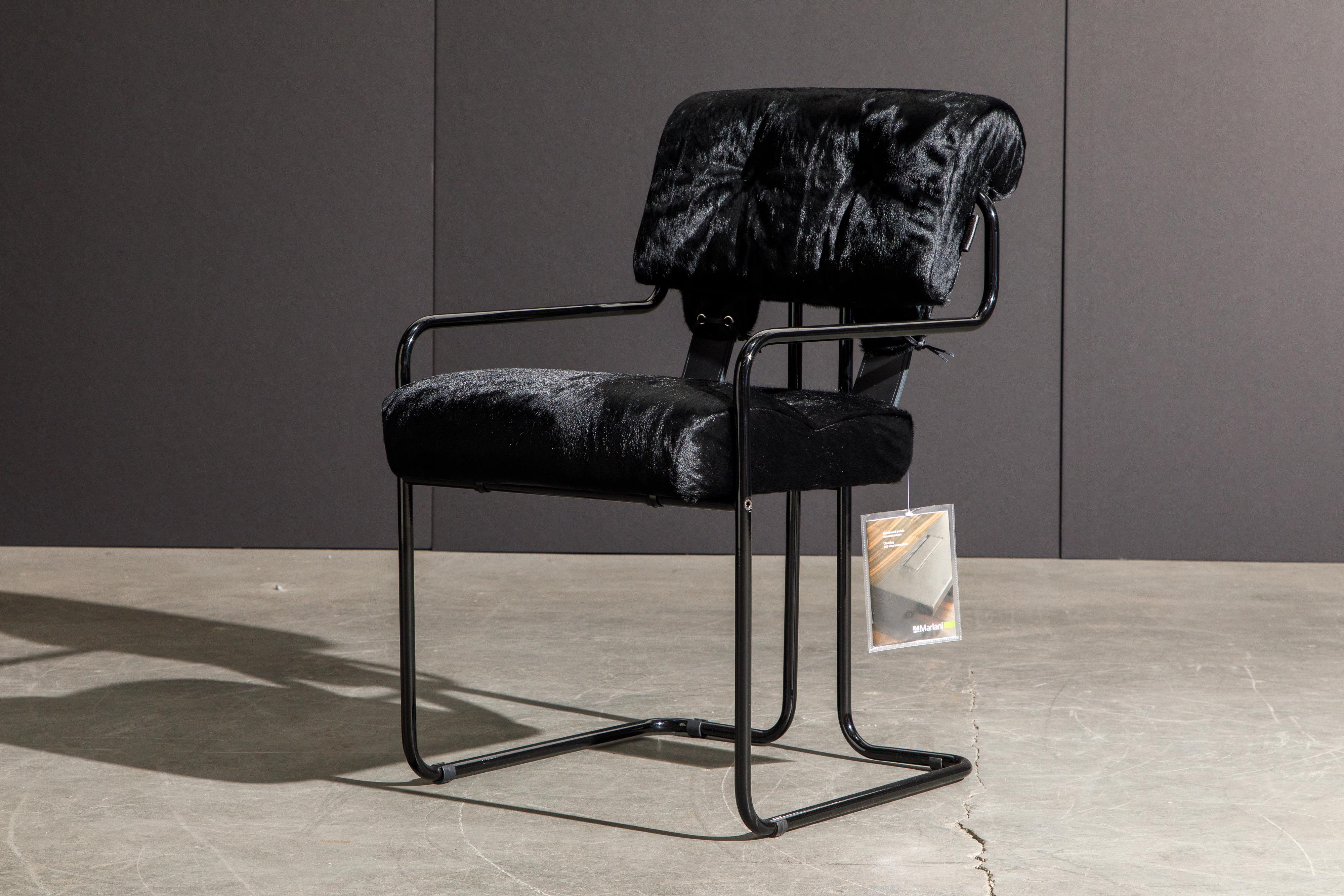Currently, the most coveted dining chairs by interior designers are 'Tucroma' chairs by Guido Faleschini for i4 Mariani, and we have this incredible Tucroma armchair (brand new) in beautiful black cowhide leather with black lacquered frames. The