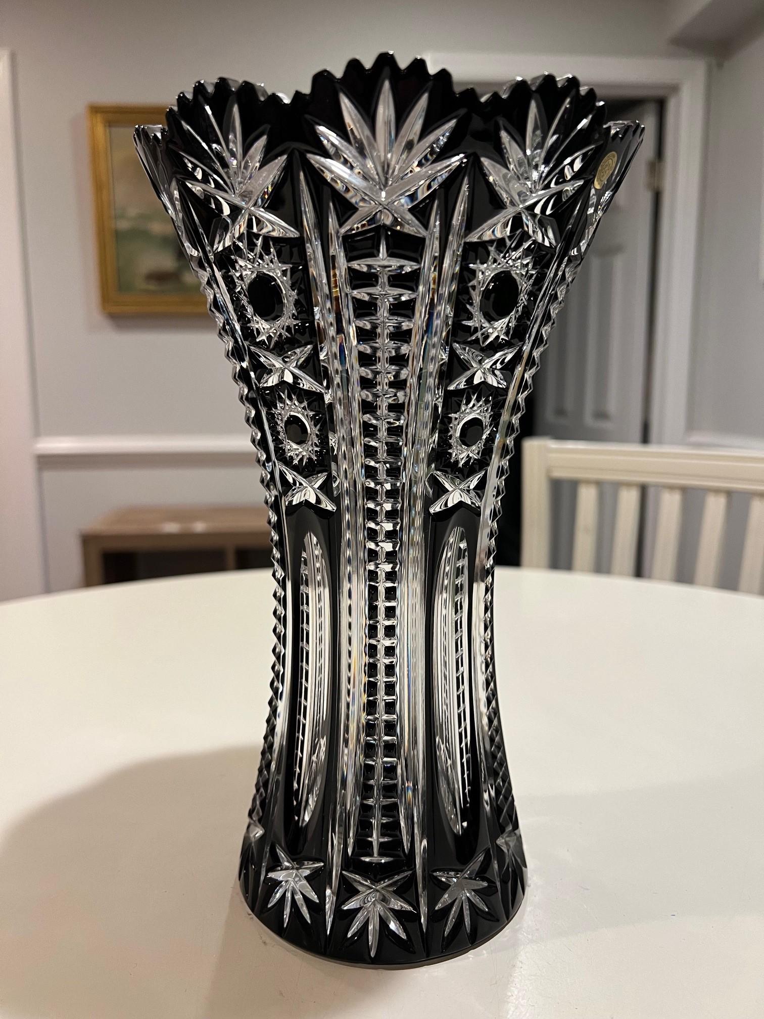 Stunning black hand cut lead crystal vase created as a work of art by the hands of the finest Czech glass workers. The Caesar Crystal Company in the Czech Republic has been selling hand cut lead crystal pieces since 1861 and is known as one of the