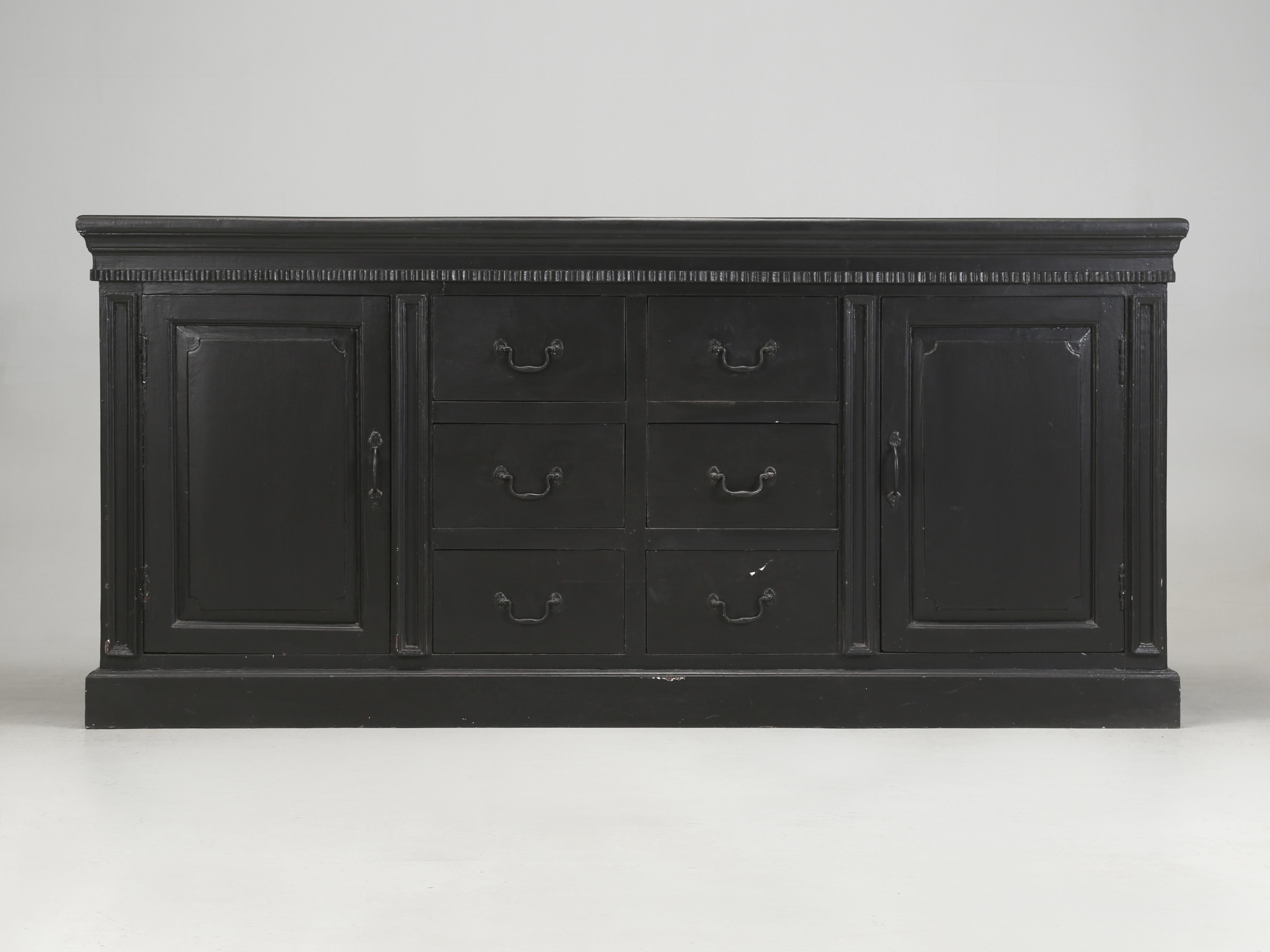 Black hand-painted Buffet or Sideboard probably made in Asia, but that is strictly a hypothesis based on the wood species, which appears to be similar to mahogany. When we look closely at our Black painted Buffet, it appears that when new it was