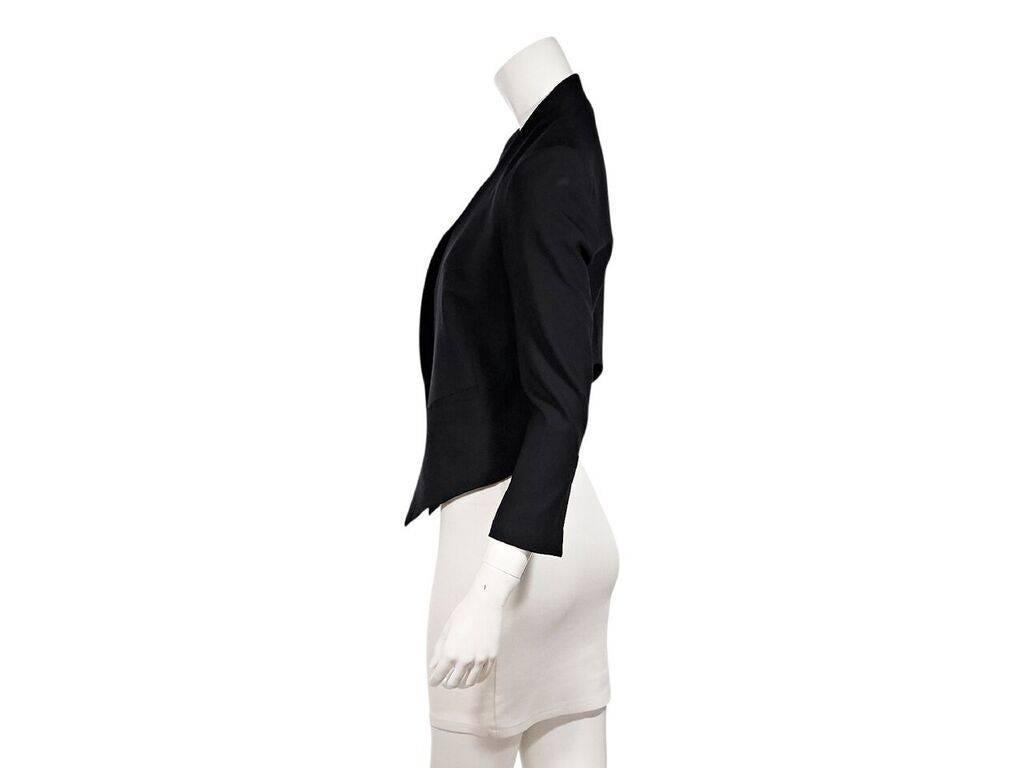 Product details:  Blazer blazer by Helmut Lang.  Lapel-less design.  Three-quarter length sleeves.  Concealed single button closure.  38