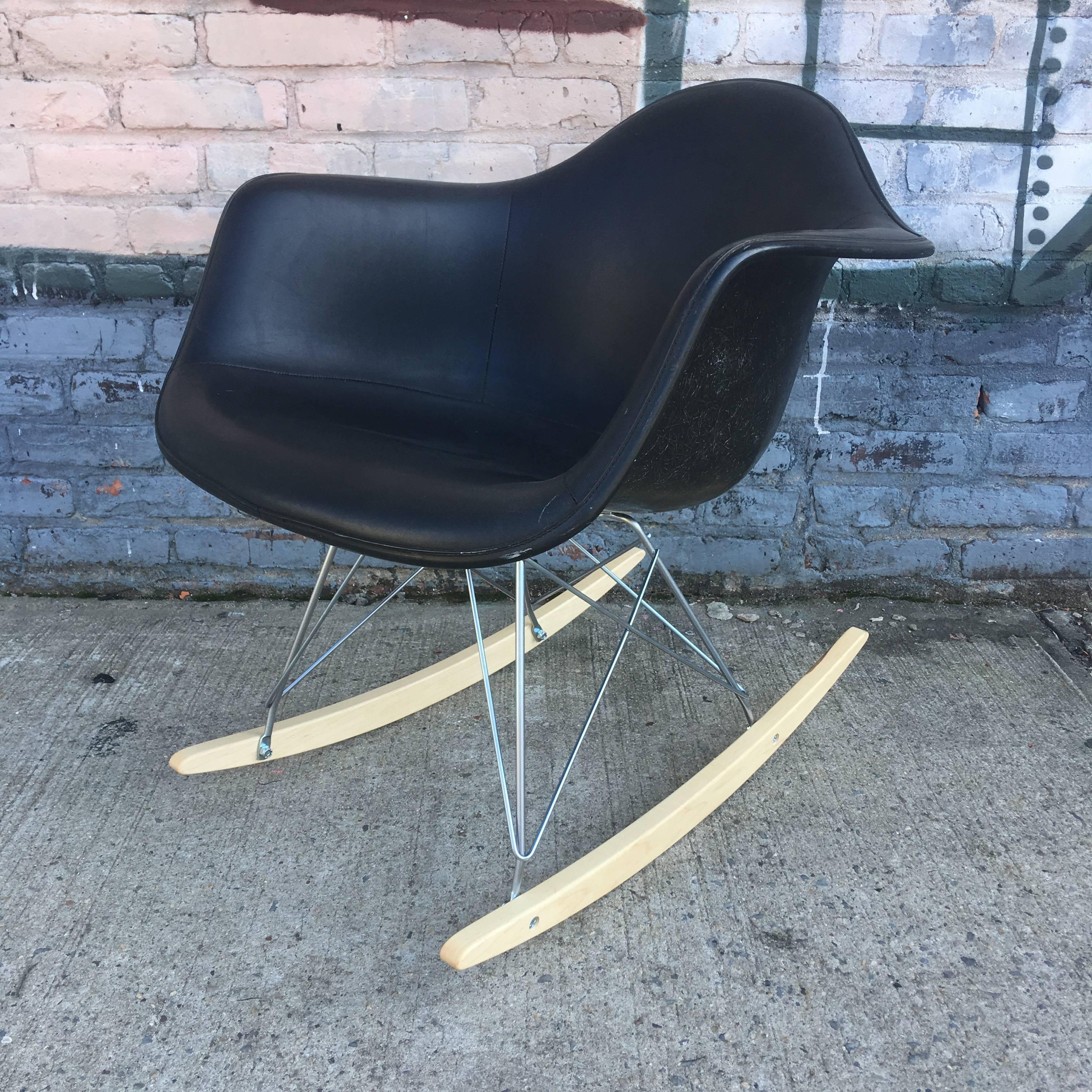 Herman Miller Eames fiberglass rocking chair. Black Naugahyde upholstery on rare black fiberglass shell. No cracks or damage to shell.