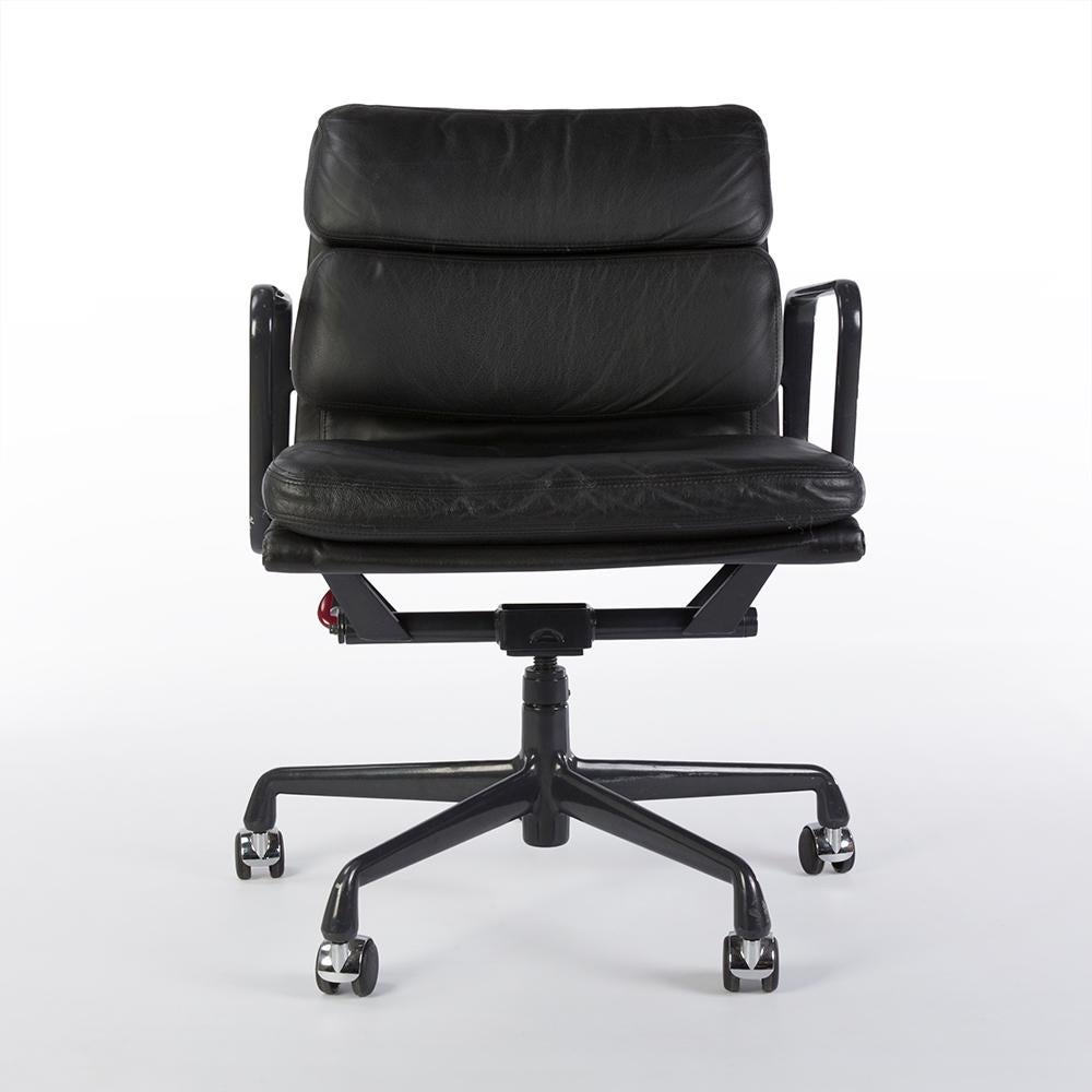 Quite possibly the perfect office chair, this original Herman Miller Eames EA435 'Soft Pad' aluminium 'desk chair' is finished in gorgeous black leather and the frame is finished in the classic 'egg-plant' finish. Being a used piece, there are signs