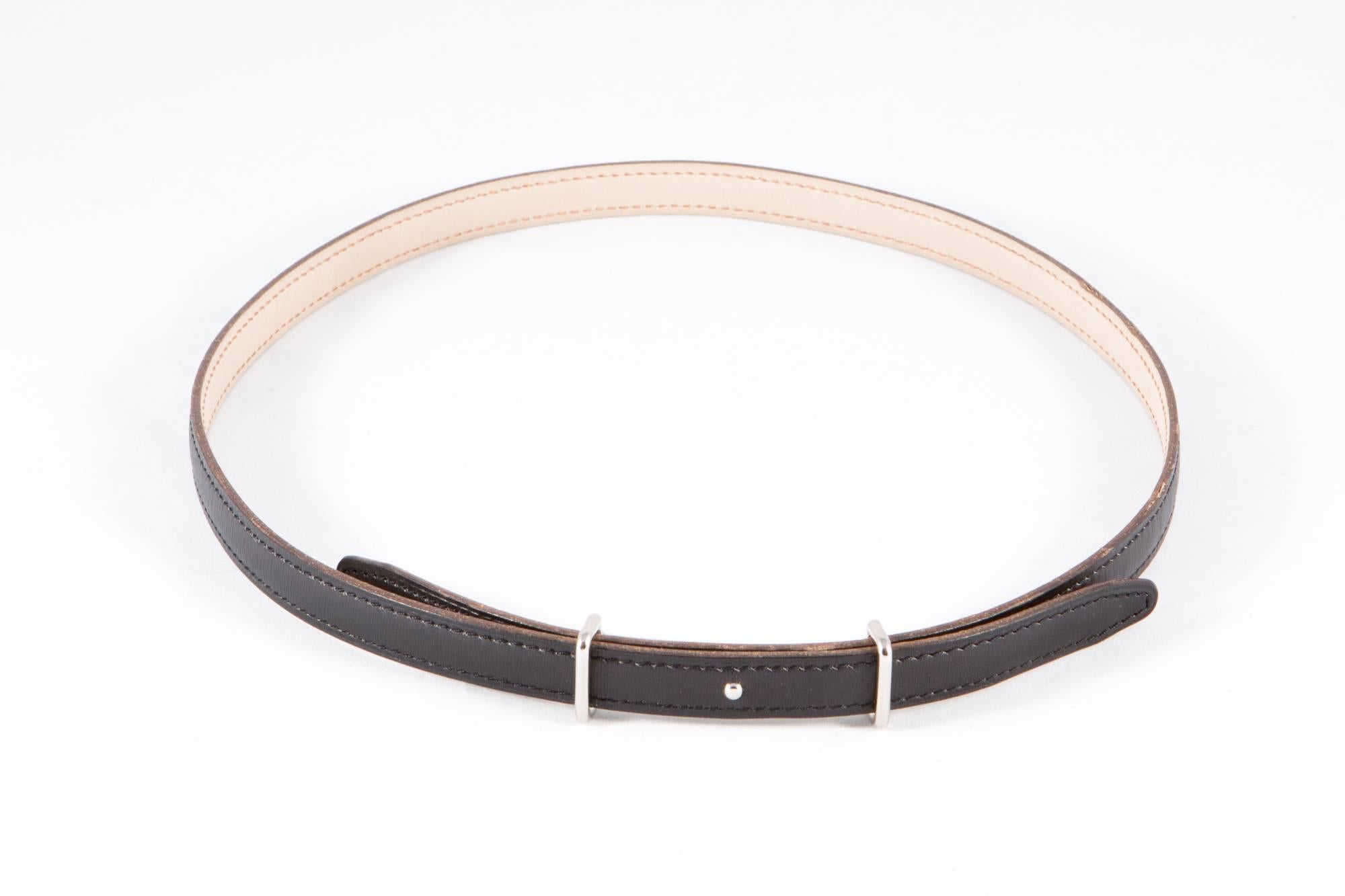 Thin black leather Hermès belt featuring a buckle in palladium plated metal & reversible leather strap in Swift/Epsom calfskin and an inside leather camel side. Letter F in square
Length:35 in. (89 cm)
In excellent vintage condition. Made in