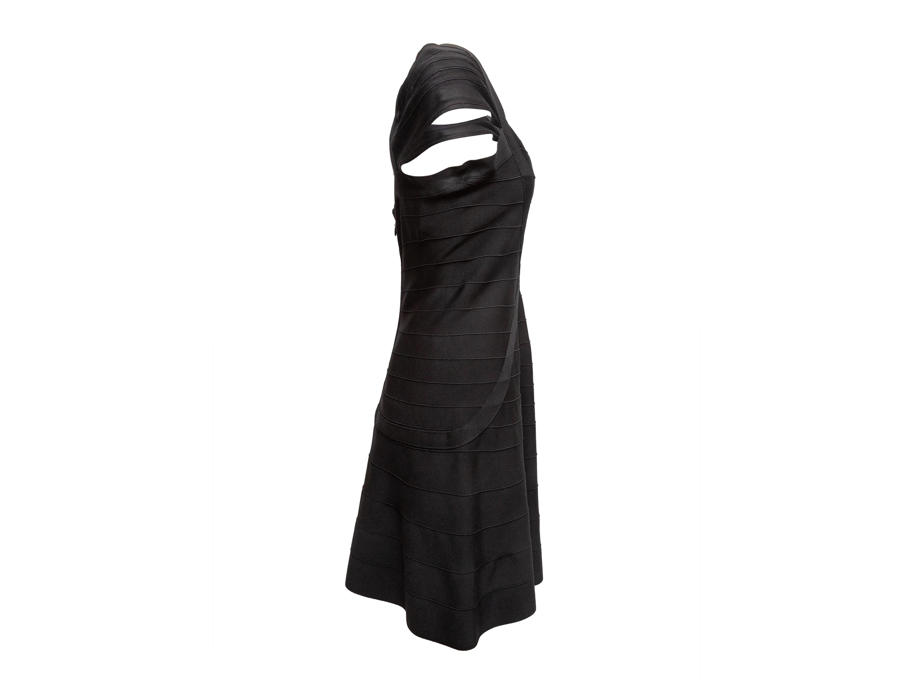 Black cap sleevel mini dress by Herve Leger. Scoop neckline. Zip closure at back. 31
