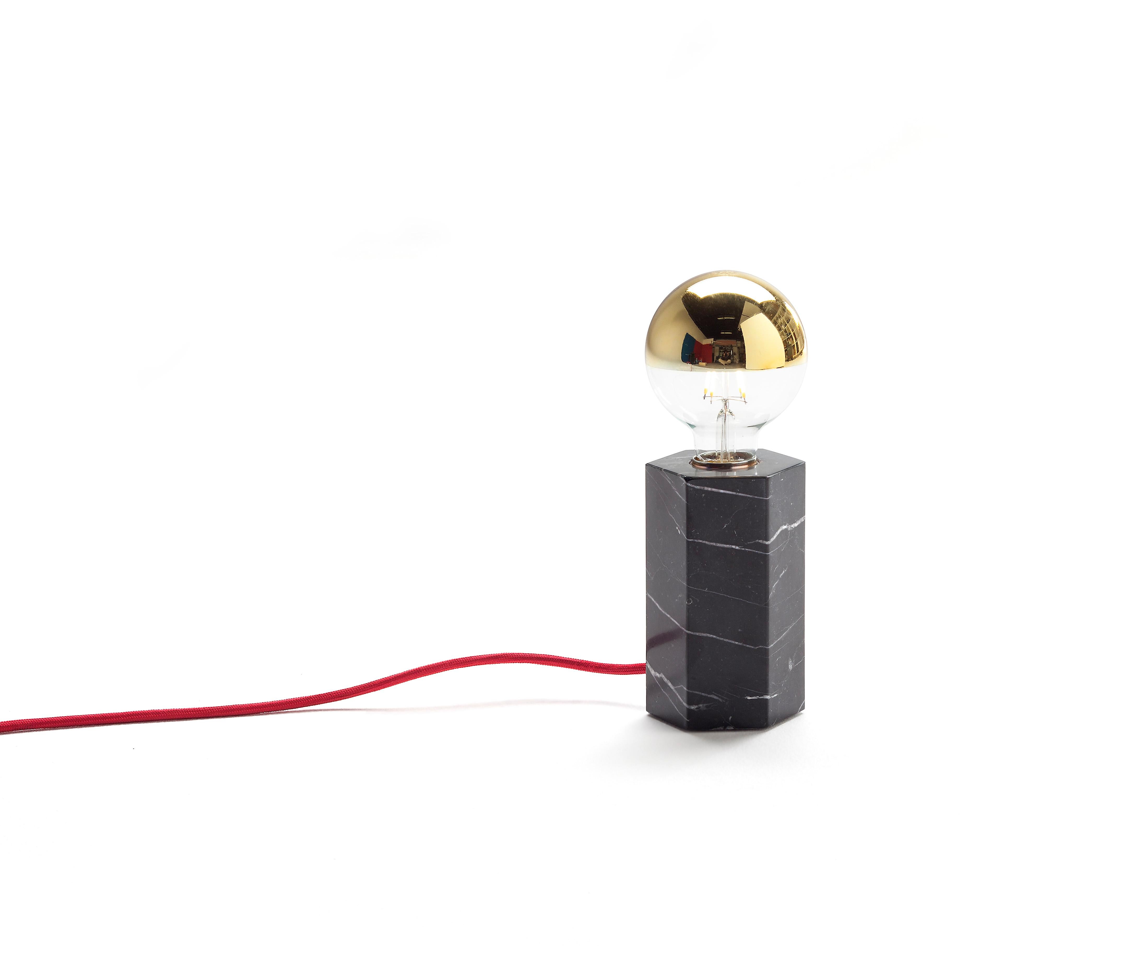 Black hex lamp by Joseph Vila Capdevila
Material: Marquina marble, red cord
Dimensions: 8.5 x 15 x 8.5 cm
 9.5 x 24.5 x 9.5 cm
 Cord 1.5 m
Weight: 2.2 kg 


Aparentment is a space for creation and innovation, experimenting with materials with the