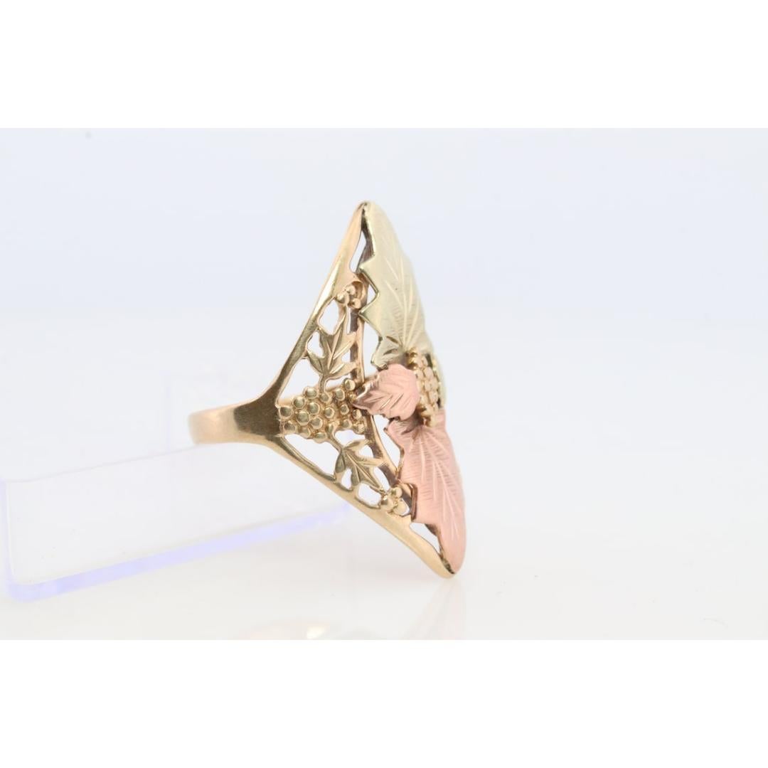 Vintage from the 1980s
Size: 8 US
Materials: Gold, Rose gold, White gold
Band Color: Rose gold

Style: Avant garde

Unique Signet ring made by the popular Black Hills Gold franchise. It is a reasonable size ring. Will look beautiful on a daily use