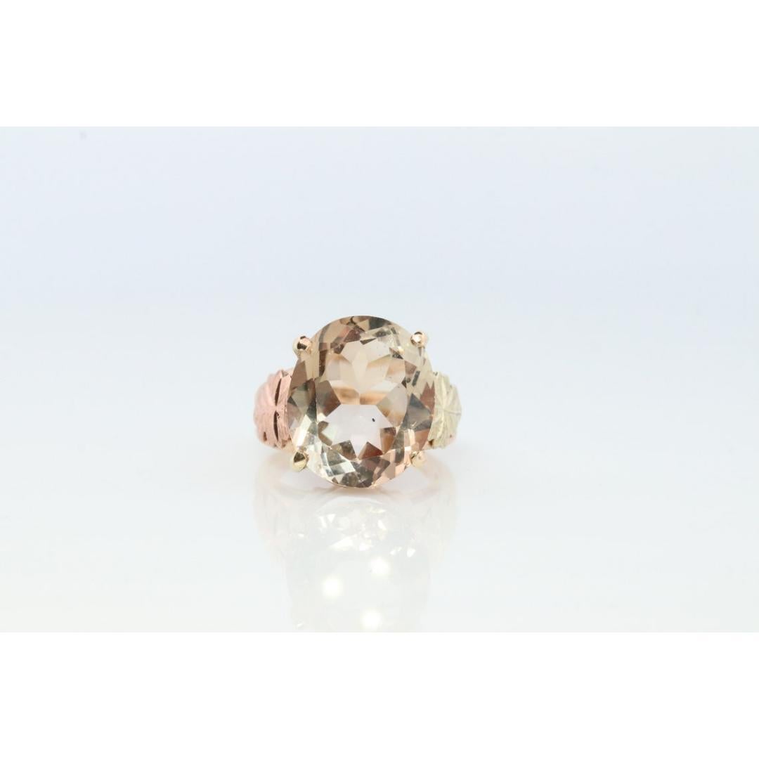 Vintage
Size: 4 3/4 US
Materials: Gold
Gemstone: Topaz
Gem color: Champagne
Band Color: Gold

Style: Minimalist

Very rare Black Hills Gold ring.

Large Imperial Topaz.

4.9 grams
12mm by 14mm Large Topaz 9.6ct weight

Size 4.75