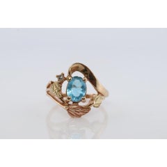 Black Hills Gold Ring. 10k Multi-Tone Blue Topaz and Diamond Black Hills Gold