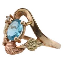 Black Hills Gold Ring. 10k Multi-Tone Blue Topaz and Diamond Black Hills Gold