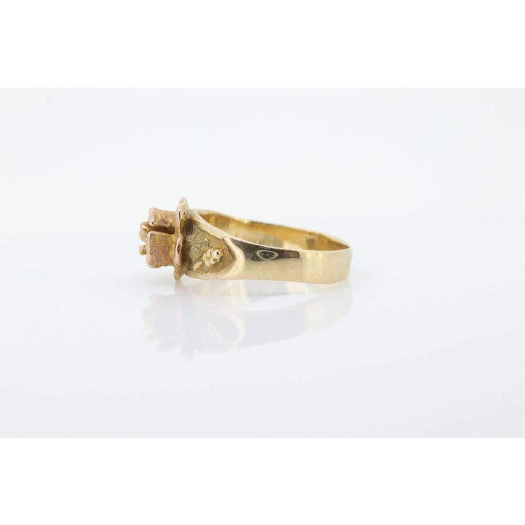 Vintage
Materials: White gold
Gemstone: Diamond
Gem Color: Colorless
Band Color: Yellow
Adjustable

Style: Mid-century

Vintage and an easily recognizable Black Hills Multi-tone Ring with a diamond set inside a rose.

This ring is Antique. Possible