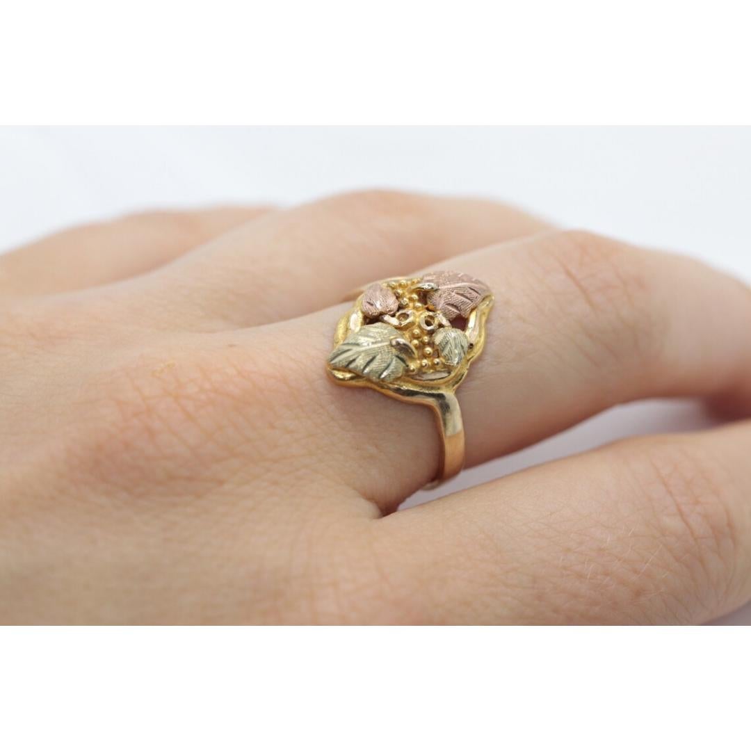 Vintage
Materials: Gold
Band Color: Gold

Style: Art Nouveau

Black Hills Gold ring. 10k Multi-tone gold.

Details:
Sz 8.5
3.5 grams total weight
18mm at widest point