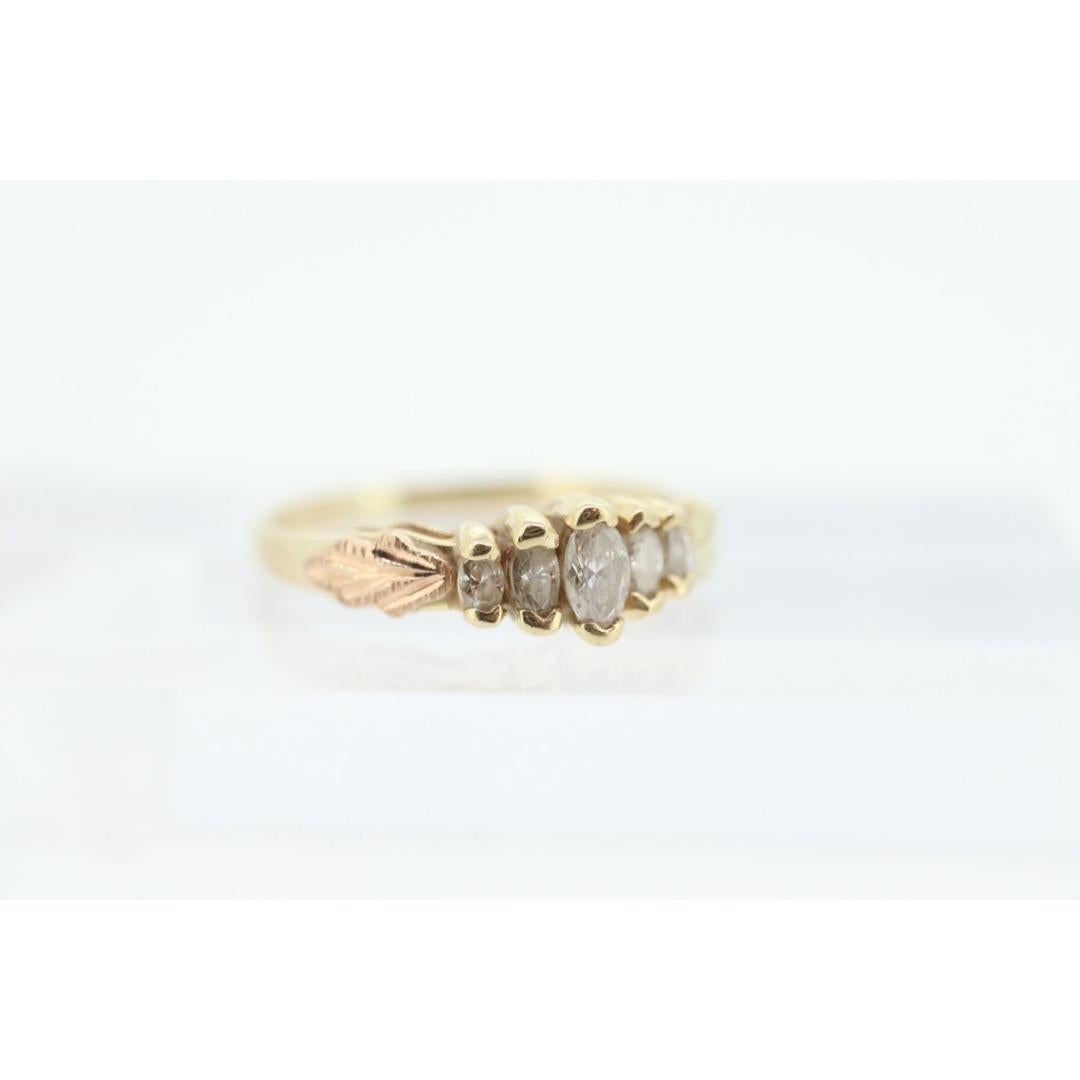 Vintage
Size: 5 1/2 US
Materials: White gold
Gemstone: Diamond
Gem Color: Colorless
Band Color: Yellow
Adjustable

Style: Mid-century

Vintage and an easily recognizable Black Hills Multi-tone Ring with marquise diamonds.

This is a unique
