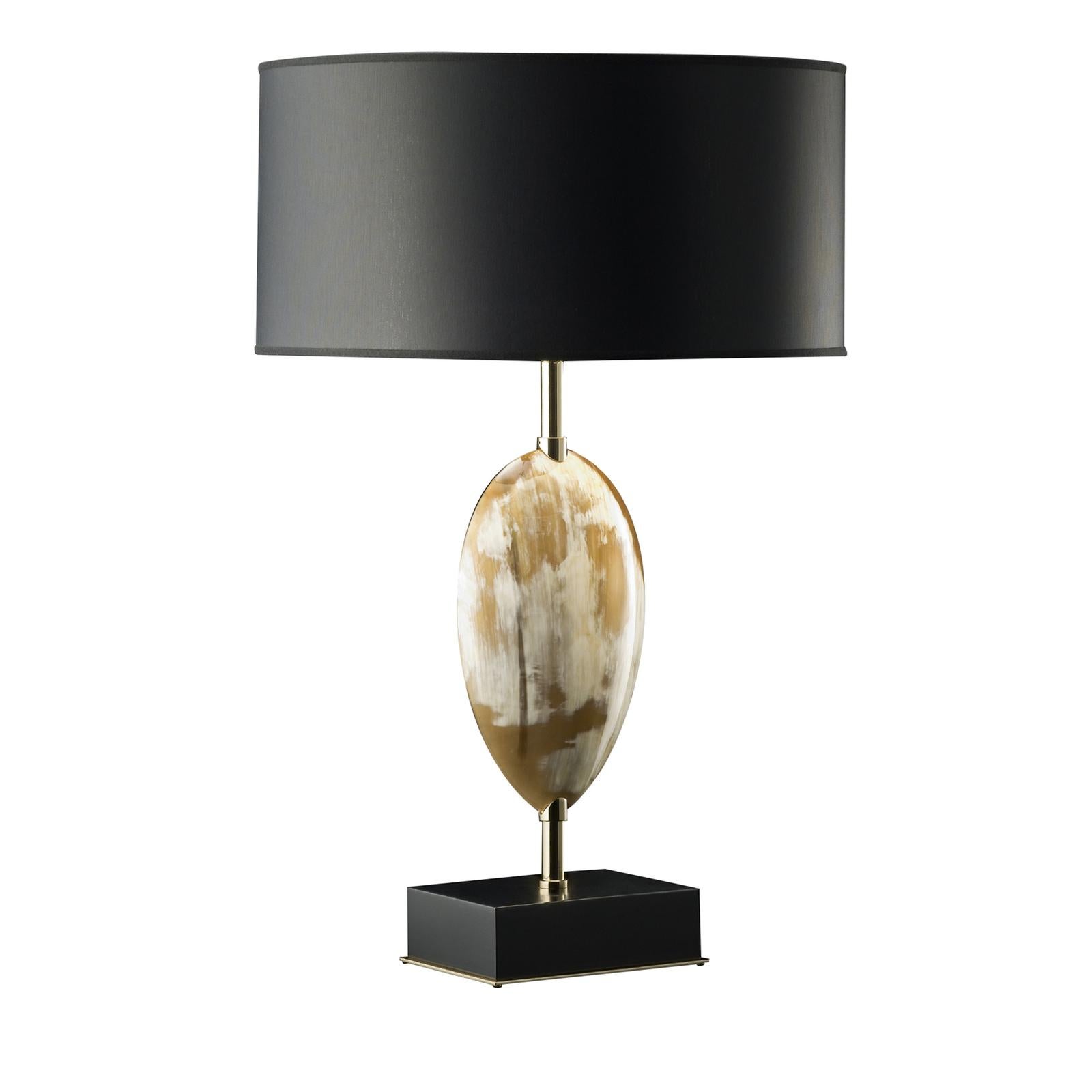 This unique table lamp is a prime example of impeccable artistry that will imbue elegance to any decor with its modern heirloom quality. The square wood base, raised on 24-karat gold-plated brass platform, with a lacquered black gloss finish, acts