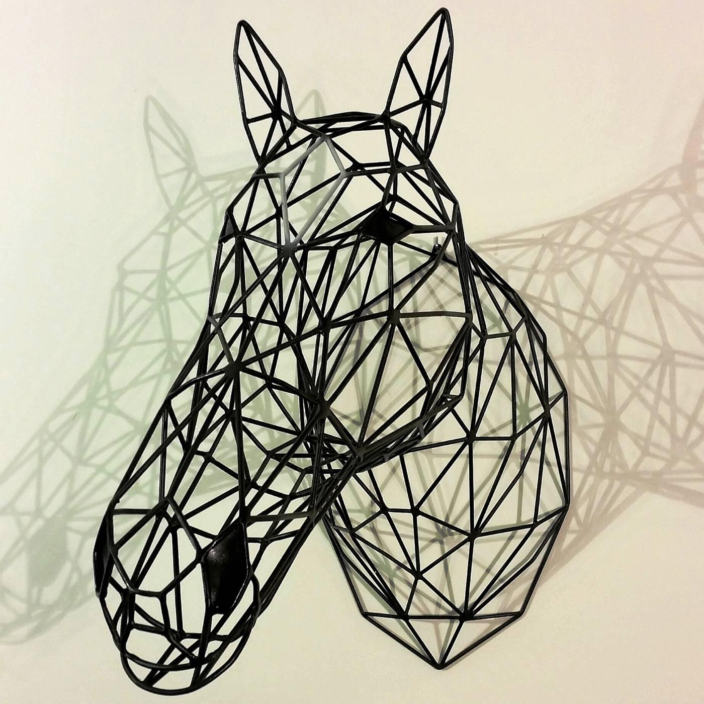 A contemporary take on the traditional trophy, this unique sculpture boasts an elegant structure and exquisite design of a horse head depicted in bold and uncompromising character. This work of art will enrich the look of a contemporary living room