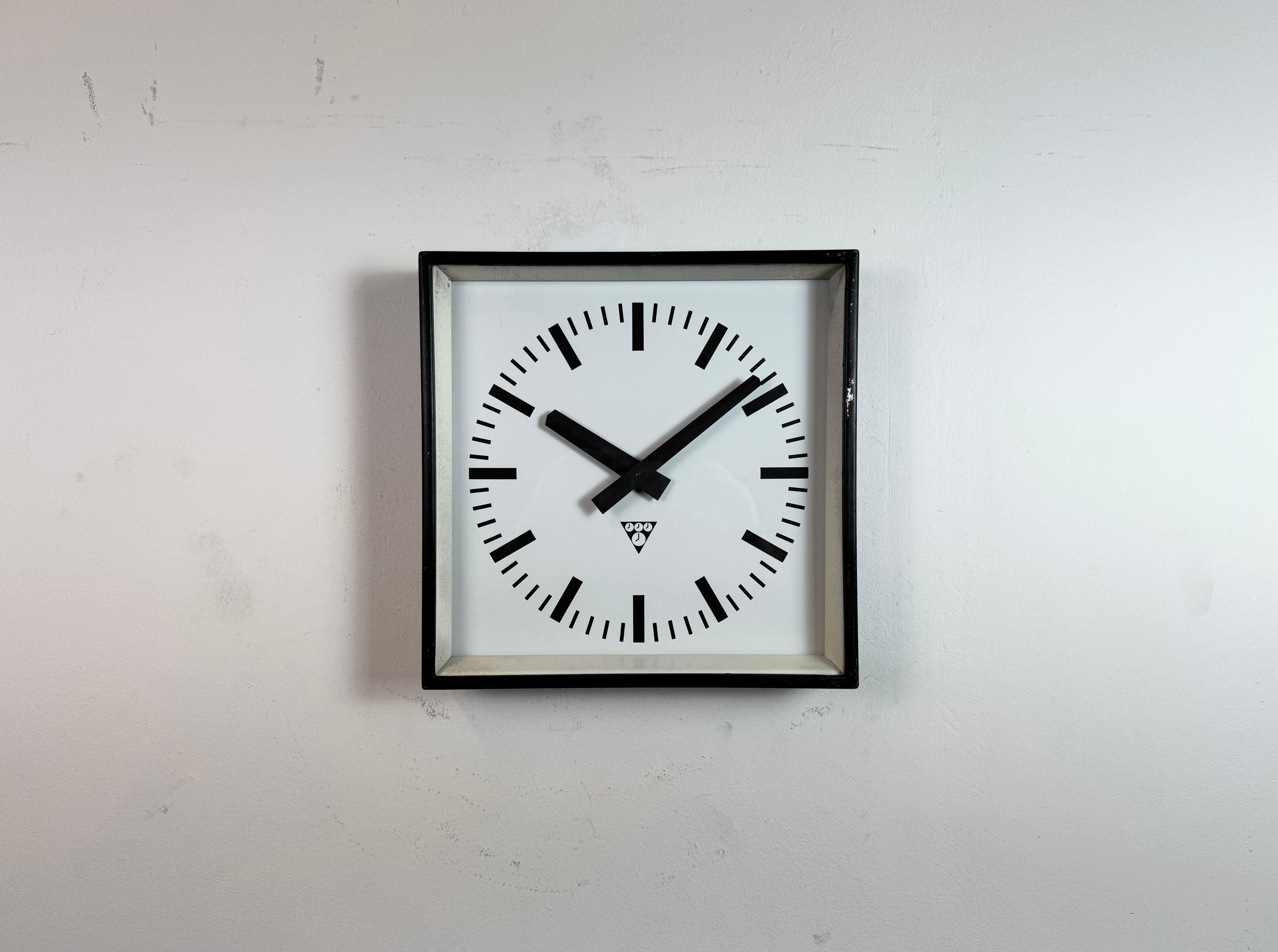 - Clock made by Pragotron in former Czechoslovakia during the 1970s 
- Was used in factories, schools and railway stations 
- Black metal body 
- Aluminium dial and hands 
- Clear glass cover 
- Former slave clock has been converted into a