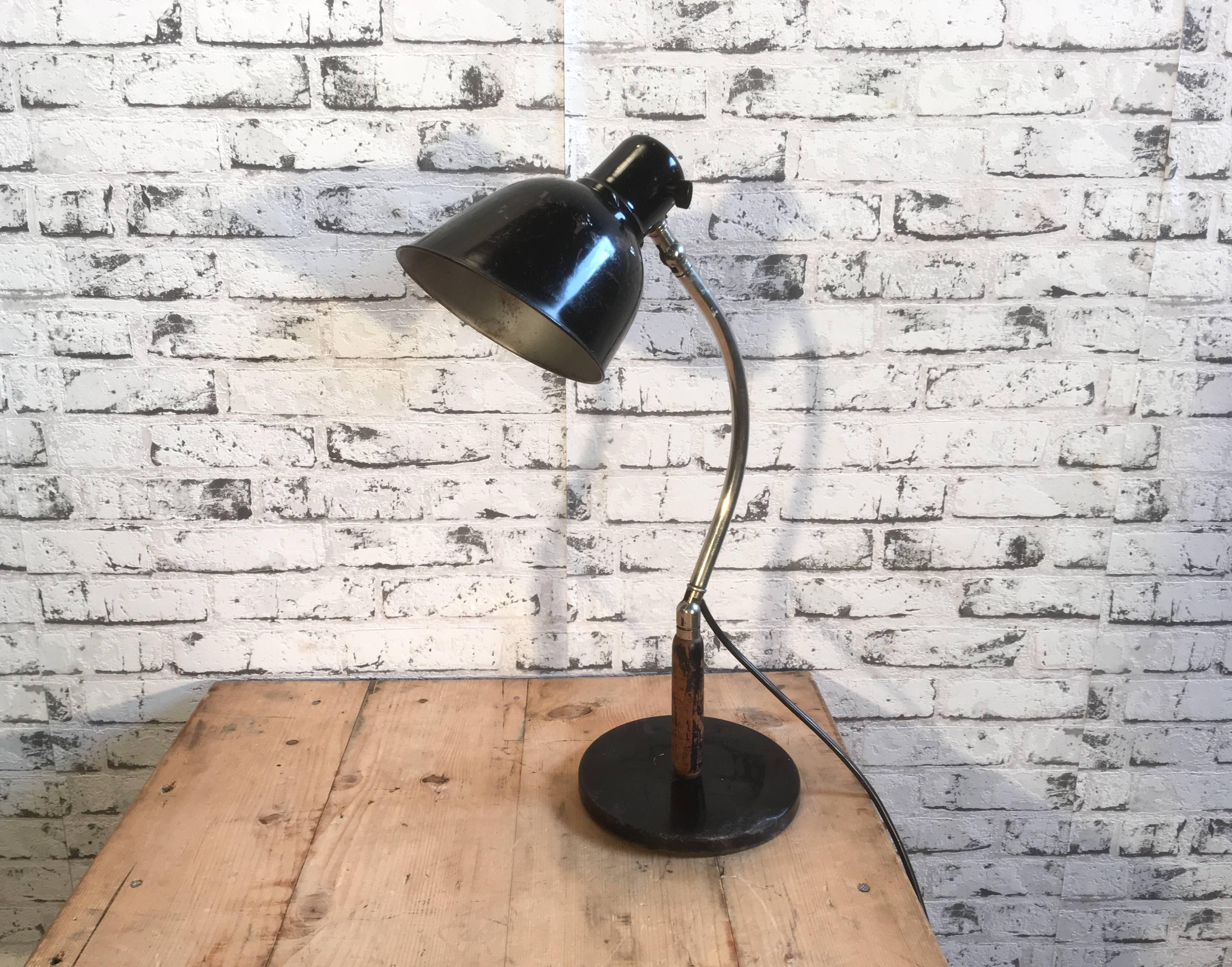 Black metal and wood industrial table lamp with two adjustable joints. Switch is located directly on the lampshade. Lamp is fully functional and in good vintage condition.
Measures: Width 19.0 cm
Height 50.0 cm
Other diameter 16 cm.