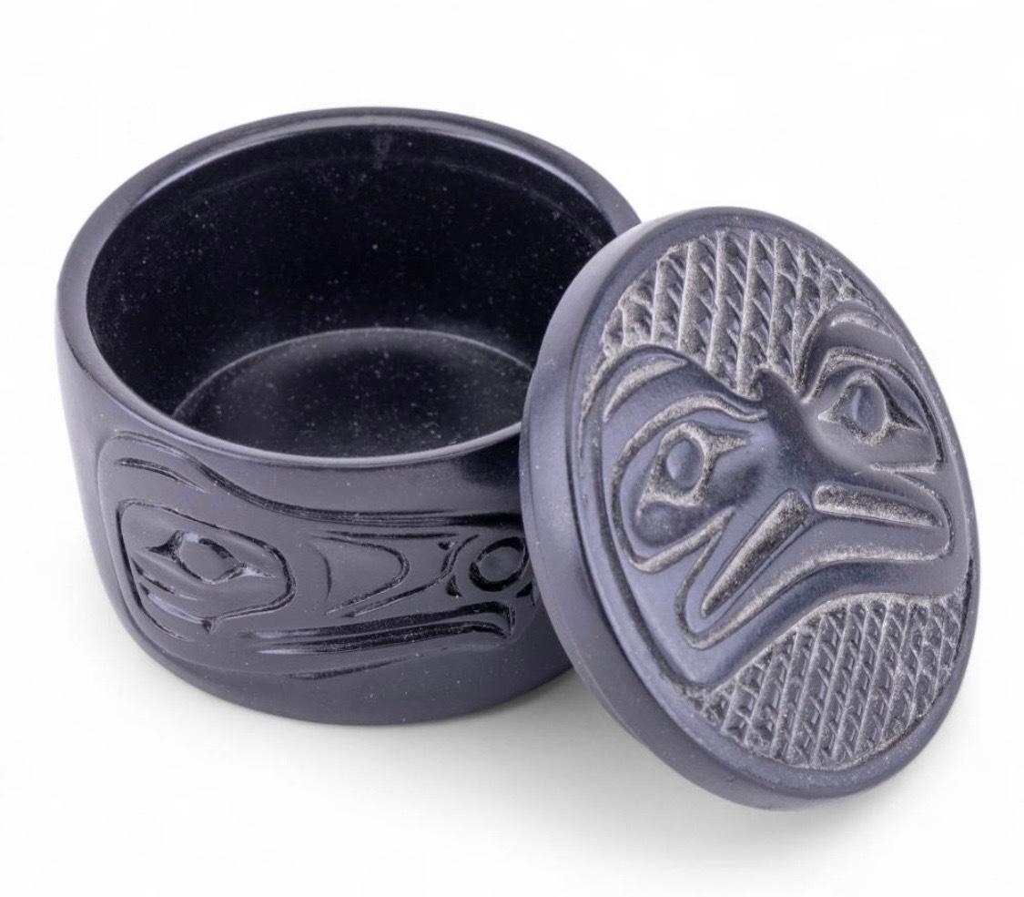 Small Round Inuit Northwest Coast Native American Lidded Box with Bird Motif: Possibly in Volcanic Pearlite

This exquisite small black lidded box captures the refined artistry of Native peoples from the Pacific Northwest Coast. Remarkable for its