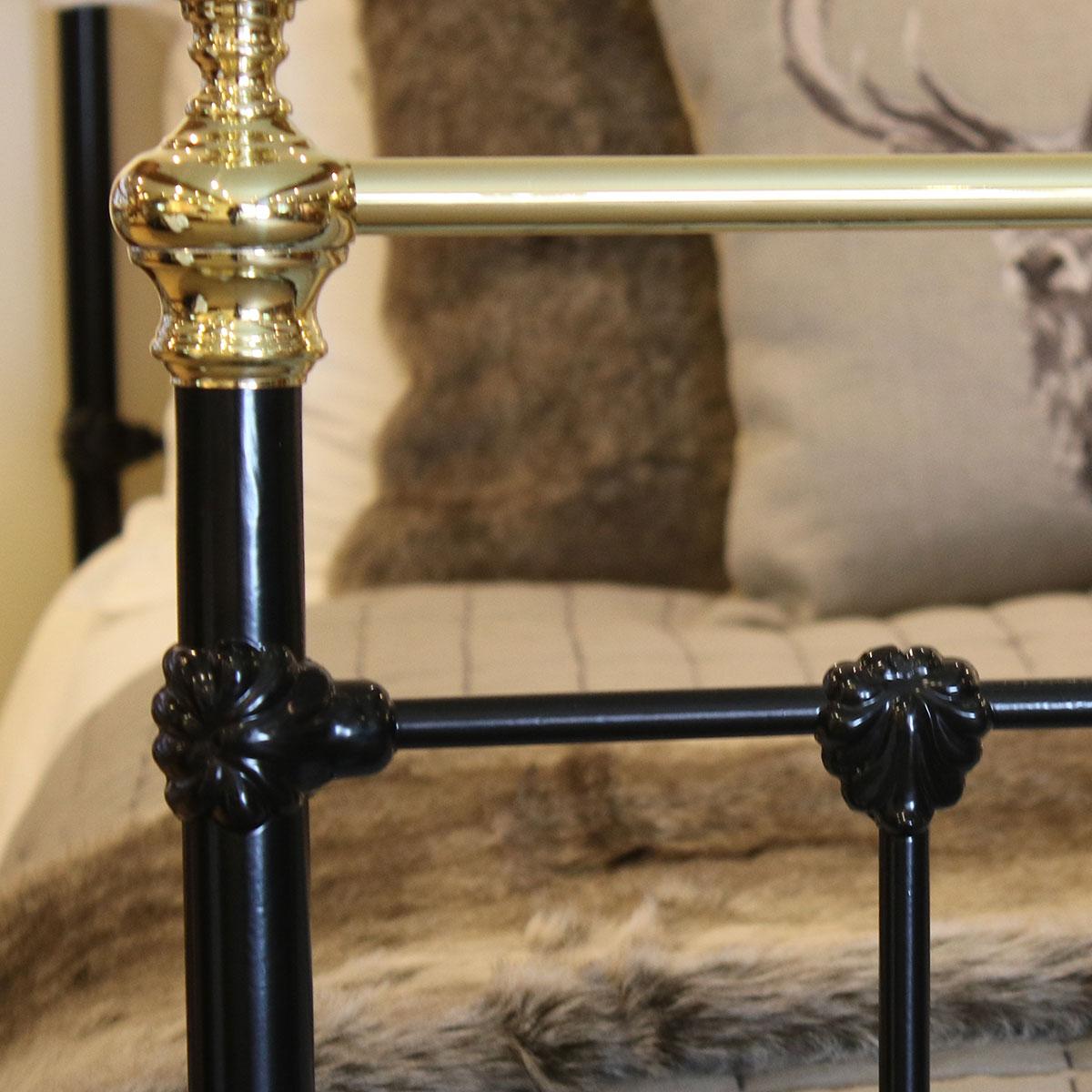 A black antique bed in brass and iron with straight brass top-rail, down bars and knobs.

This bed accepts a British King Size or American Queen Size (5ft wide, 60 inches or 150cm) base and mattress set.

The price is for the bed frame alone.
