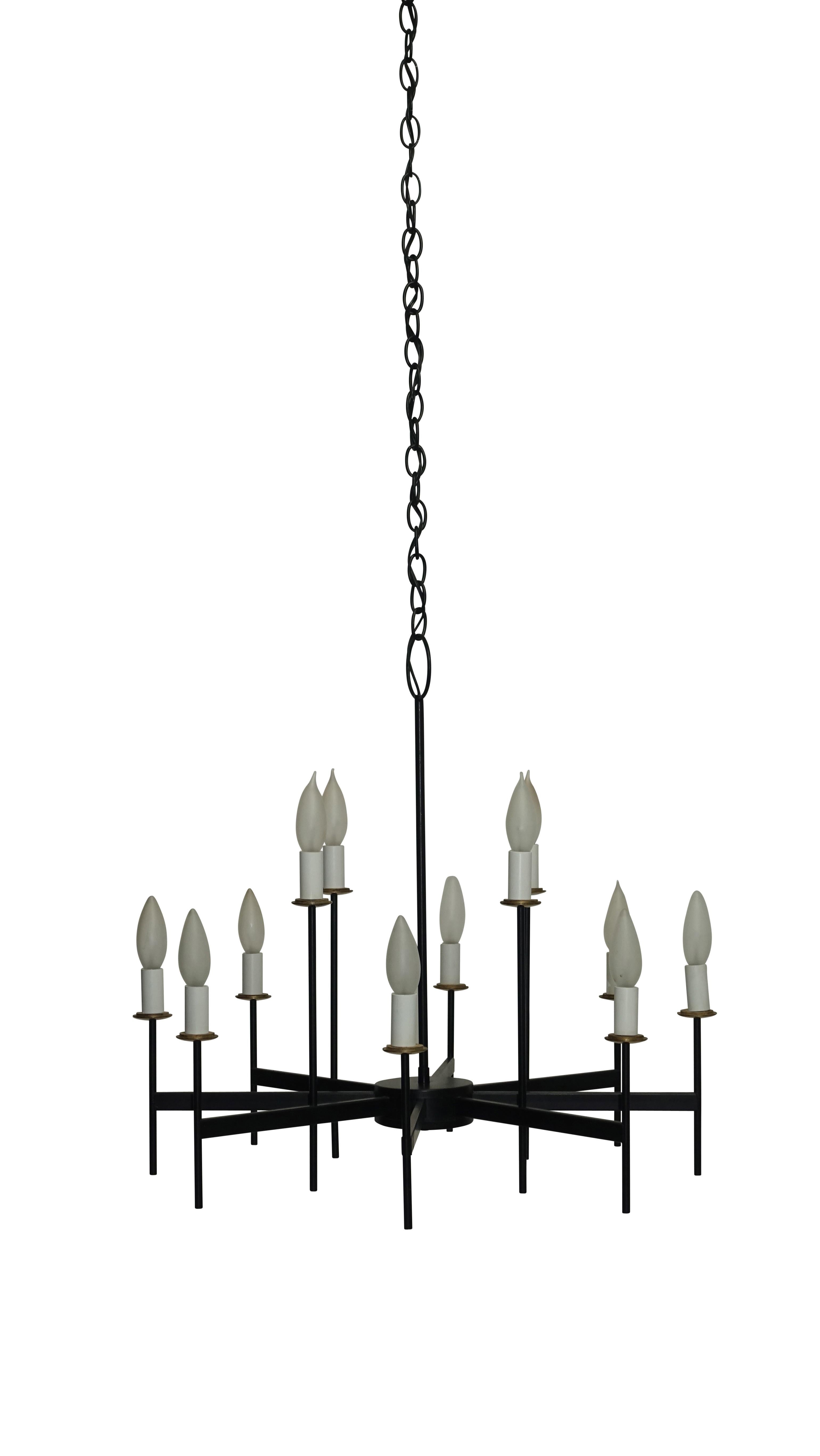 Black iron with brass twelve-arm light fixture. Recently re-wired, holds chandelier size light bulbs. American, mid-20th century.