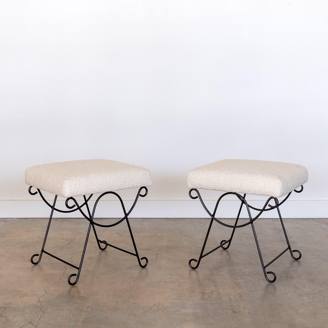 Beautiful iron stool with curved and looped base painted in a matte black finish. Rectangular cushioned seat upholstered in a boucle fabric or can be COM. Multiple available, sold individually. Please inquire for current lead time. 
