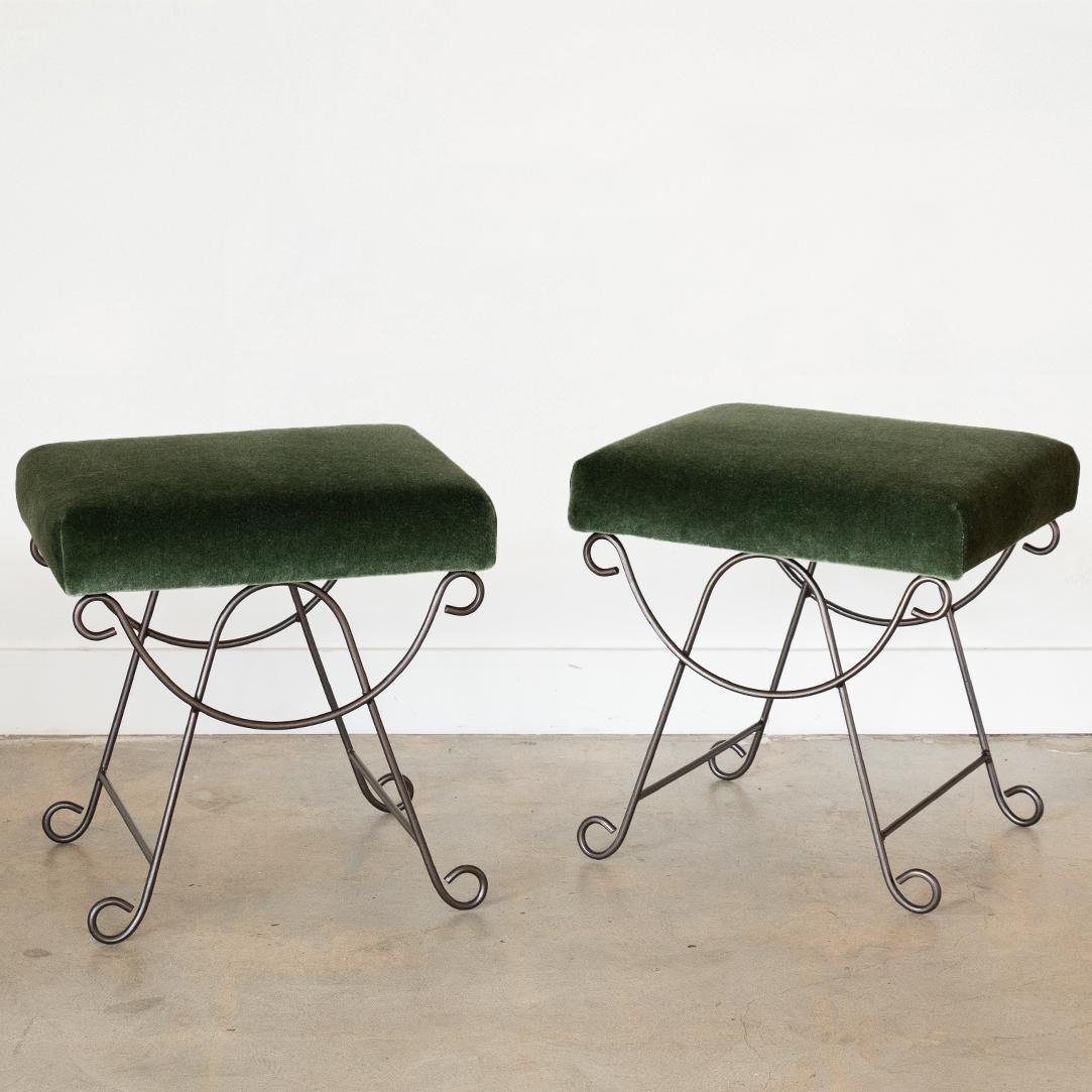Beautiful iron stool with curved and looped base painted in a satin black finish. Rectangular cushioned seat upholstered in an emerald mohair or can be COM. Multiple available, sold individually.